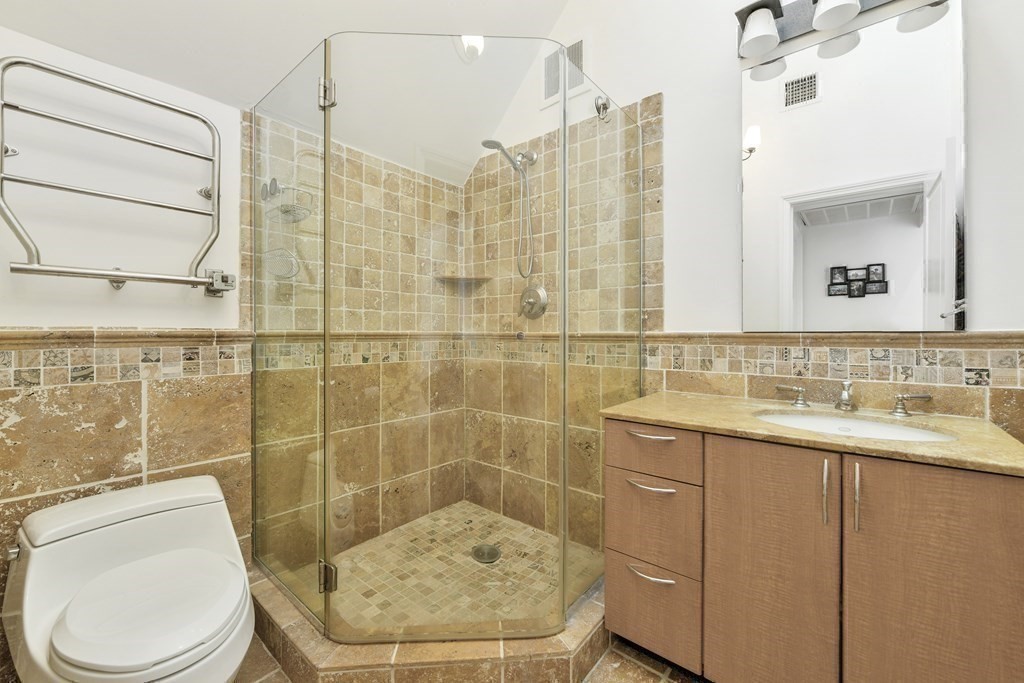 492 Beacon Street, Unit 82 Boston, MA 02115 - Photo 13 of 21 a bathroom with a sink toilet and shower
