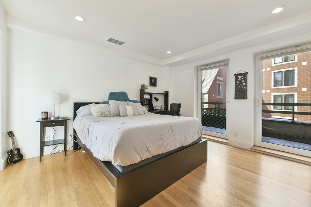 492 Beacon Street, Unit 82 Boston, MA 02115 - Photo 16 of 21 a bedroom with a bed and a large window