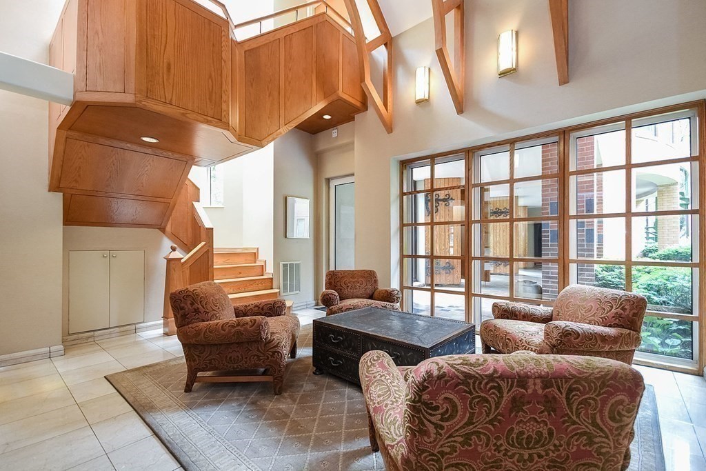 492 Beacon Street, Unit 82 Boston, MA 02115 - Photo 17 of 21 a living room with furniture a lamp and a potted plant