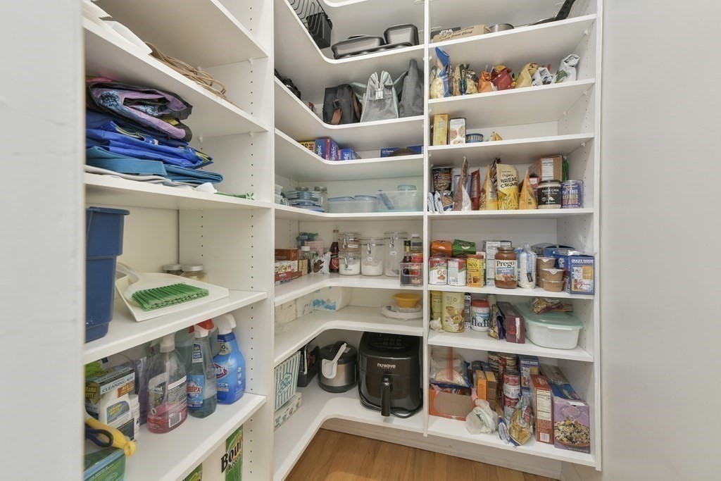 492 Beacon Street, Unit 82 Boston, MA 02115 - Photo 9 of 21 a kitchen with lots of clutter and cabinets