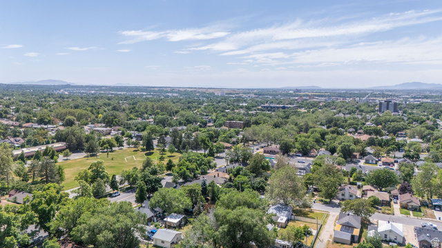 1256 24th Street Ogden, UT 84401 - Photo 28 of 34 Aerial perspective showcasing a verdant residential area with mature trees