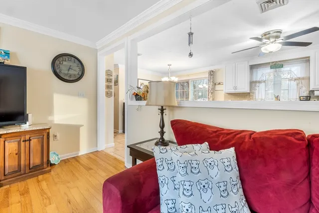 a bedroom with a large bed and a flat tv screen