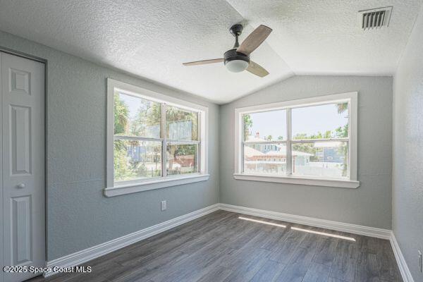 693 Law Street, Unit B Melbourne, FL 32935 - Photo 4 of 8 a view of an empty room with wooden floor and a window