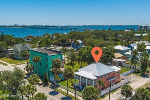 693 Law Street, Unit B Melbourne, FL 32935 - Photo 8 of 8 an aerial view of a house with a yard and lake view