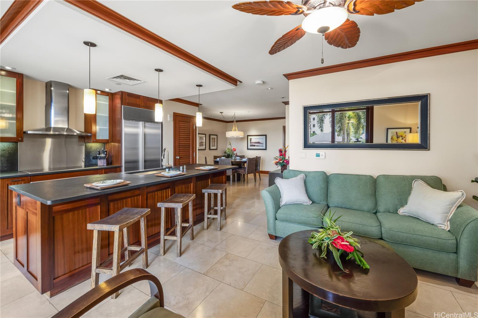 92-104 Waialii Place, Unit O202 Kapolei, HI 96707 - Photo 11 of 25 a living room with furniture kitchen view and a large window