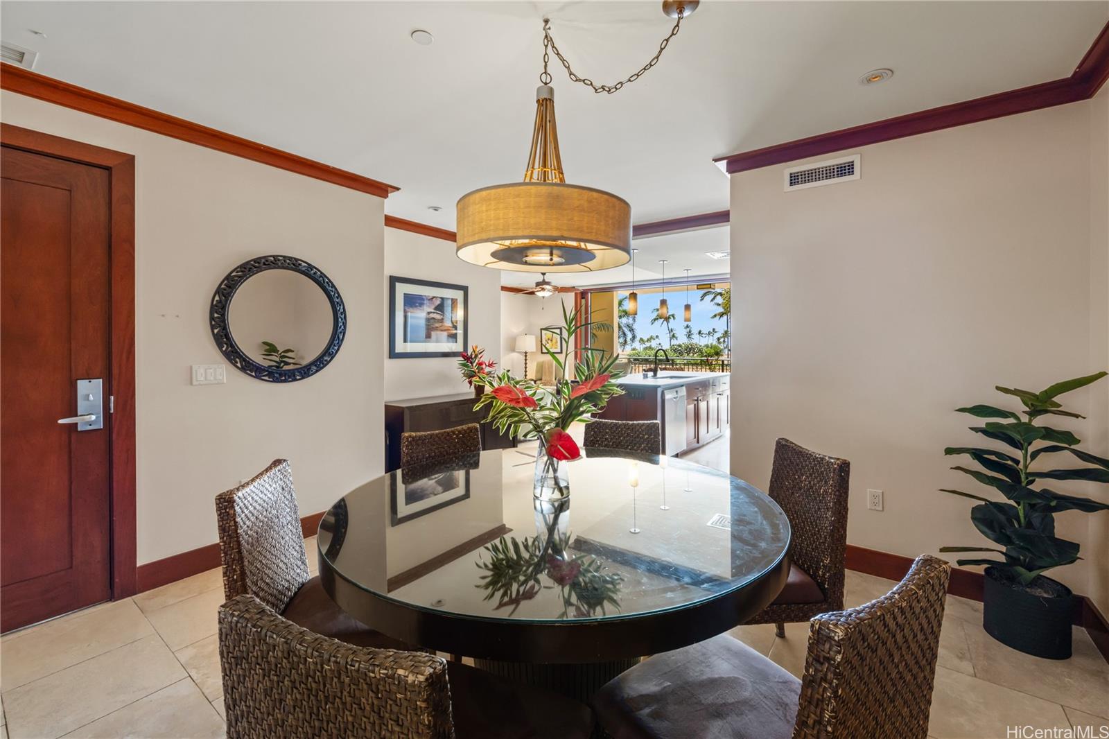 92-104 Waialii Place, Unit O202 Kapolei, HI 96707 - Photo 12 of 25 a dining room with furniture a window and wooden floor