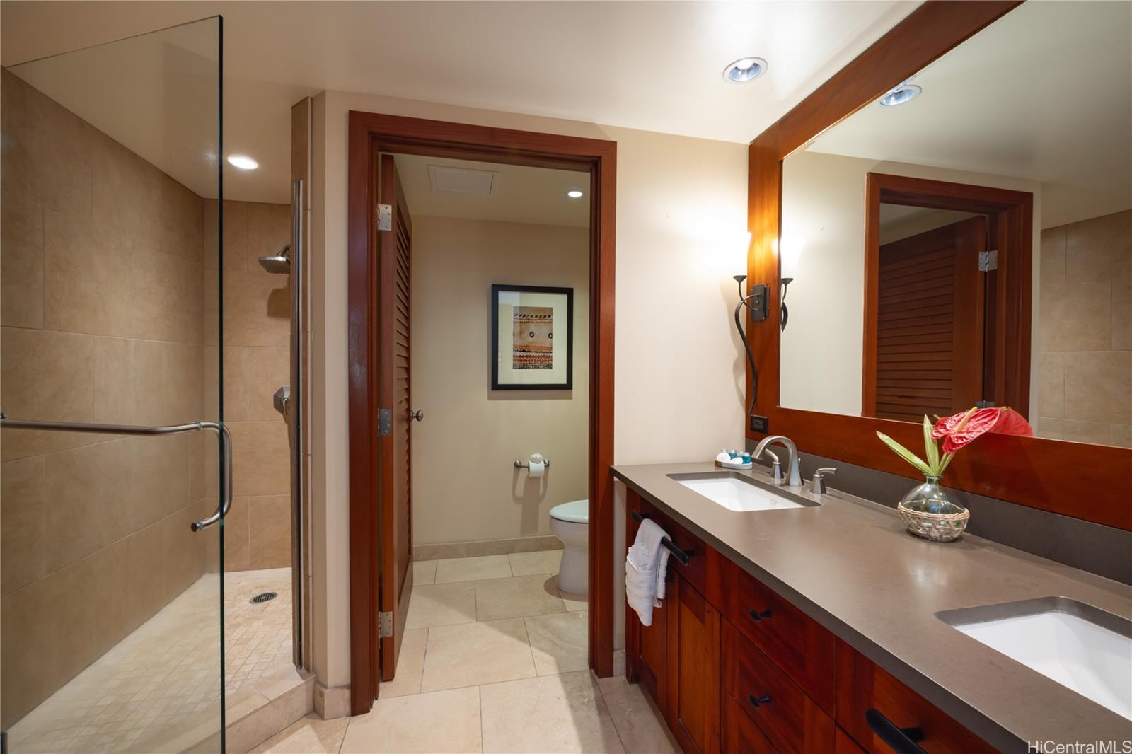 92-104 Waialii Place, Unit O202 Kapolei, HI 96707 - Photo 16 of 25 a bathroom with a sink and a mirror