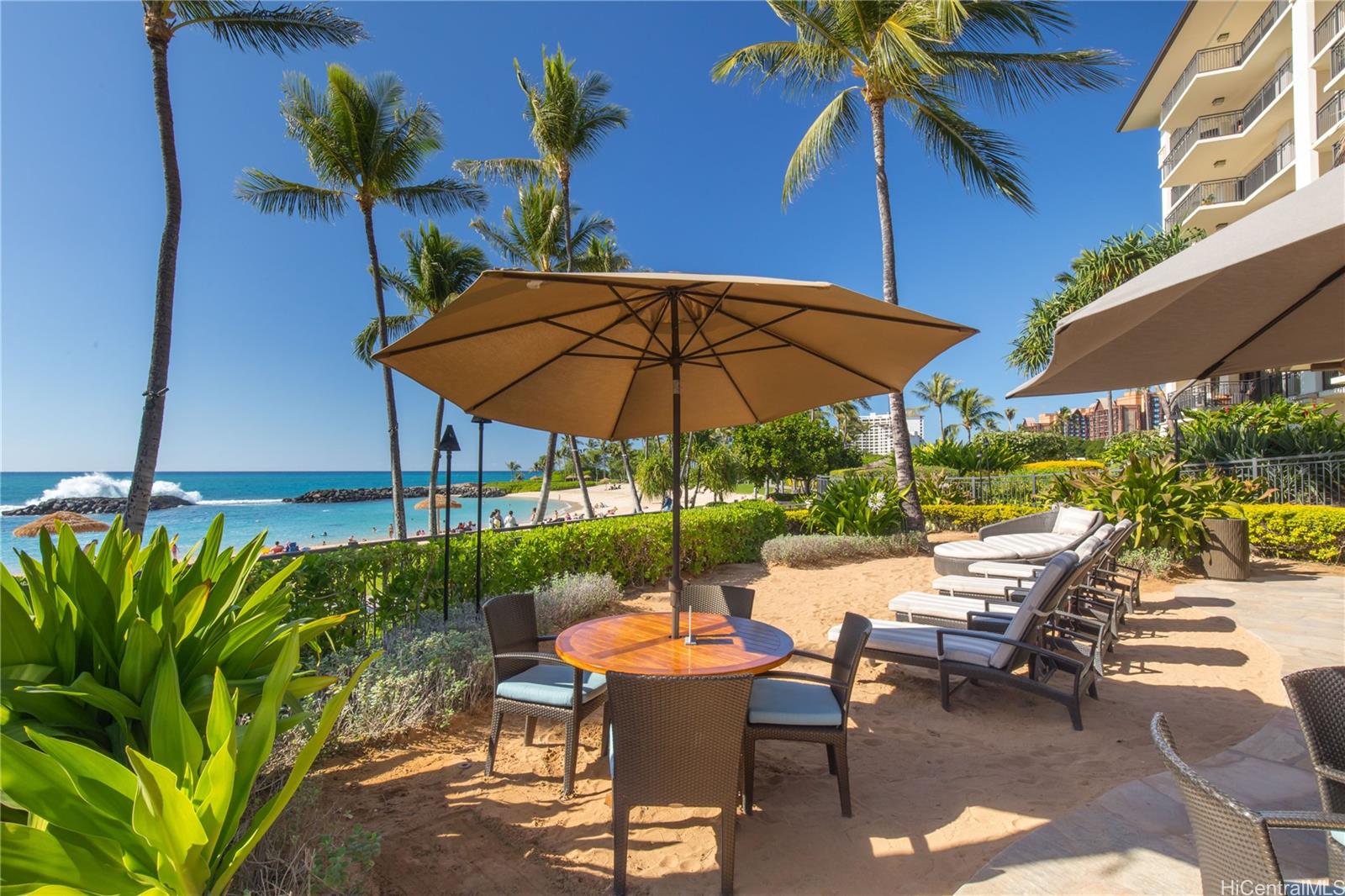 92-104 Waialii Place, Unit O202 Kapolei, HI 96707 - Photo 24 of 25 a view of patio with chairs and table under an umbrella