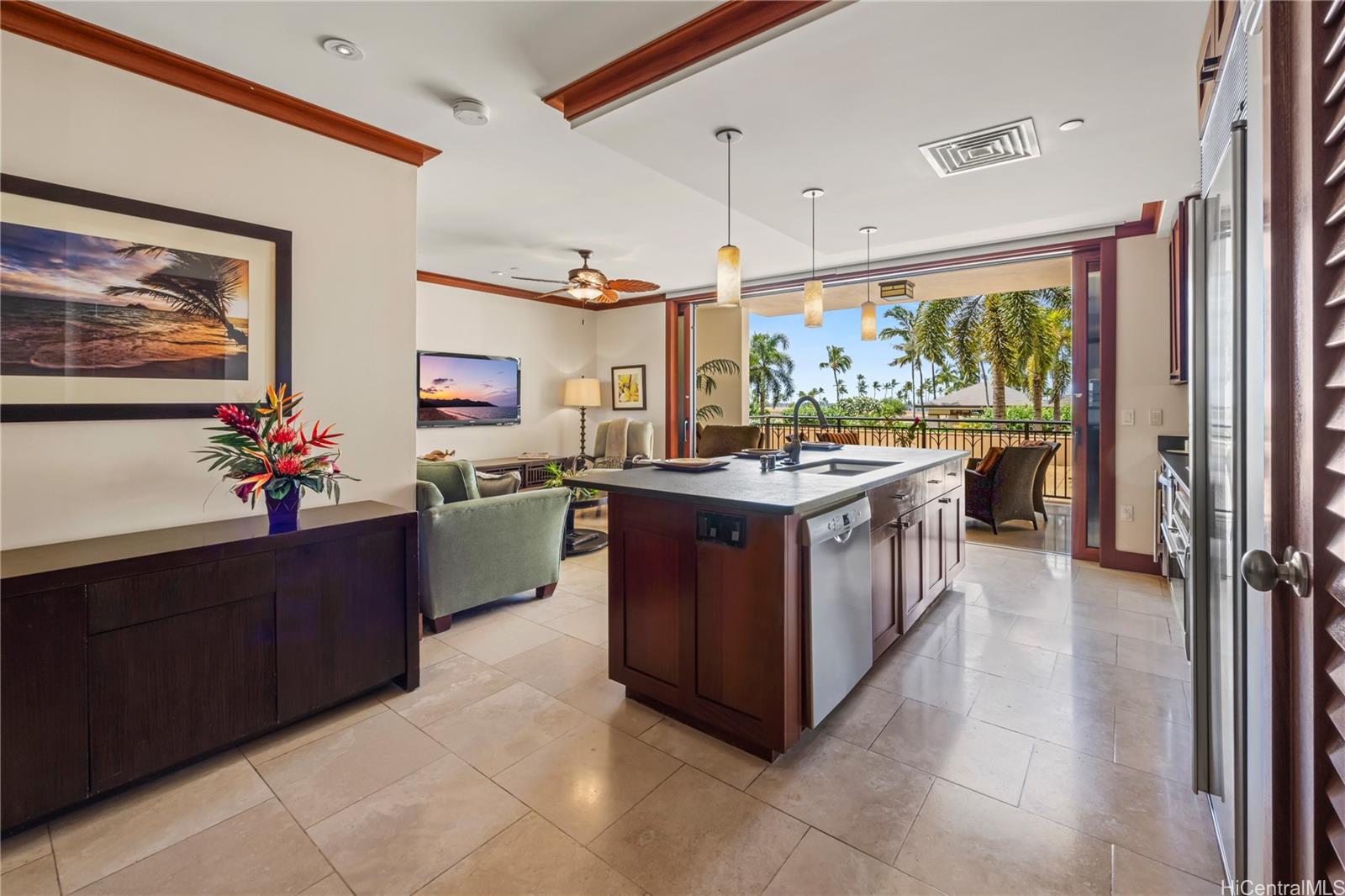 92-104 Waialii Place, Unit O202 Kapolei, HI 96707 - Photo 6 of 25 a kitchen with stainless steel appliances a sink and a refrigerator