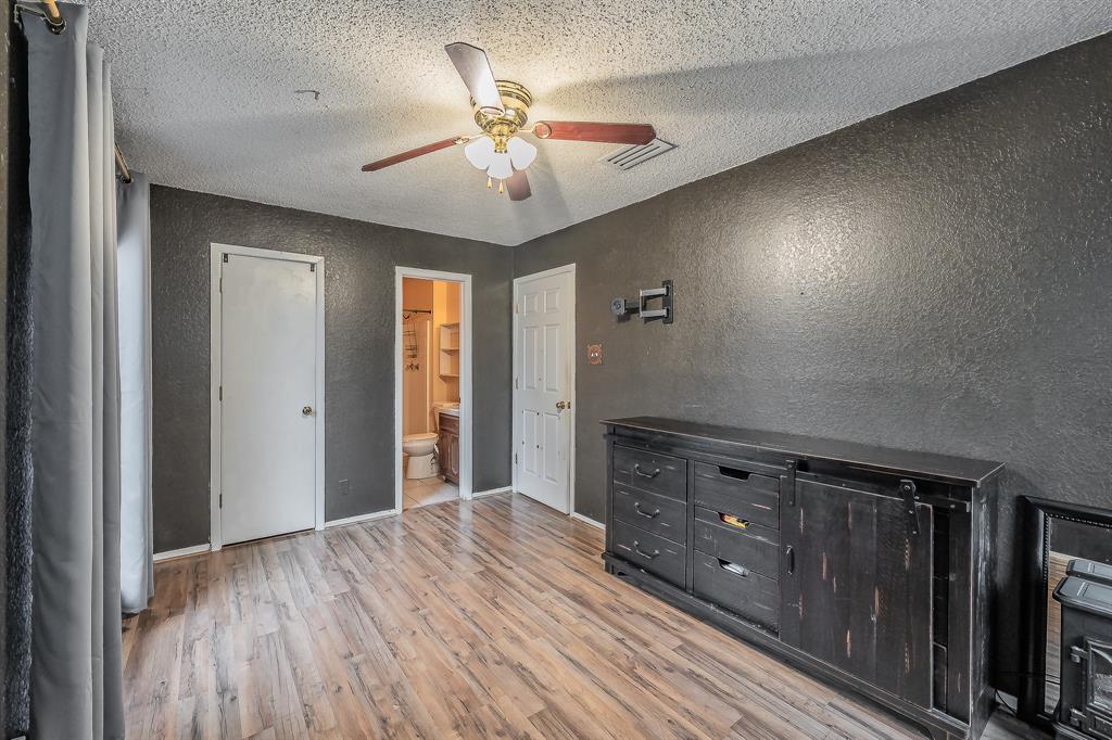 102 Perdue Circle Weatherford, TX 76085 - Photo 14 of 39 a view of an empty room and wooden floor