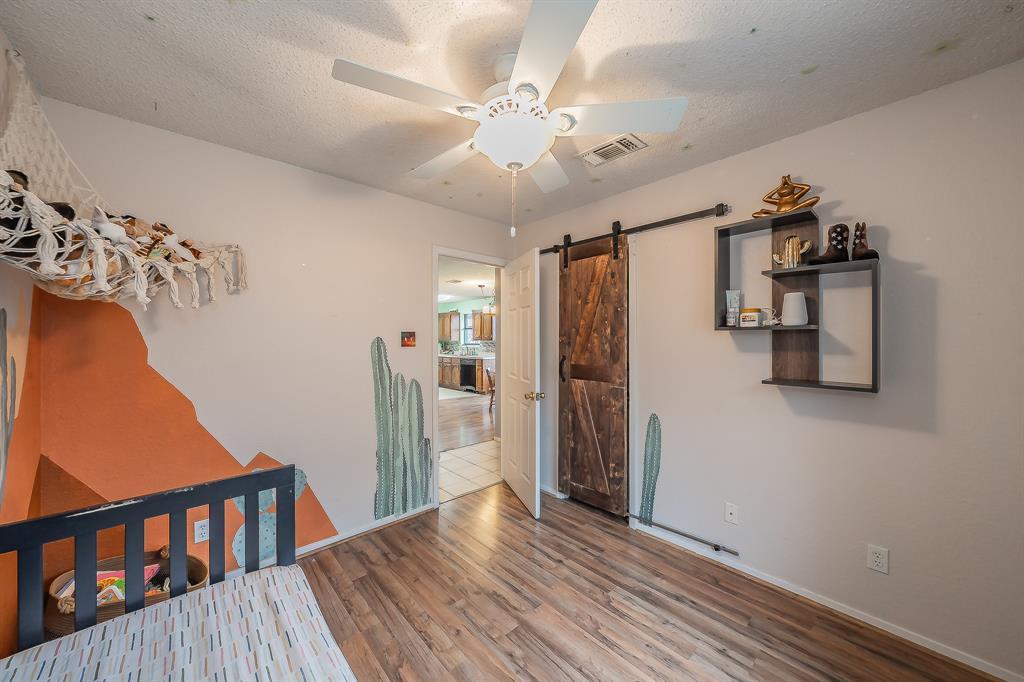 102 Perdue Circle Weatherford, TX 76085 - Photo 20 of 39 a view of a livingroom with a furniture hardwood floor and hallway