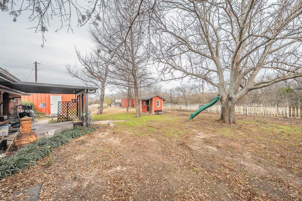 102 Perdue Circle Weatherford, TX 76085 - Photo 26 of 39 a view of a yard with a tree