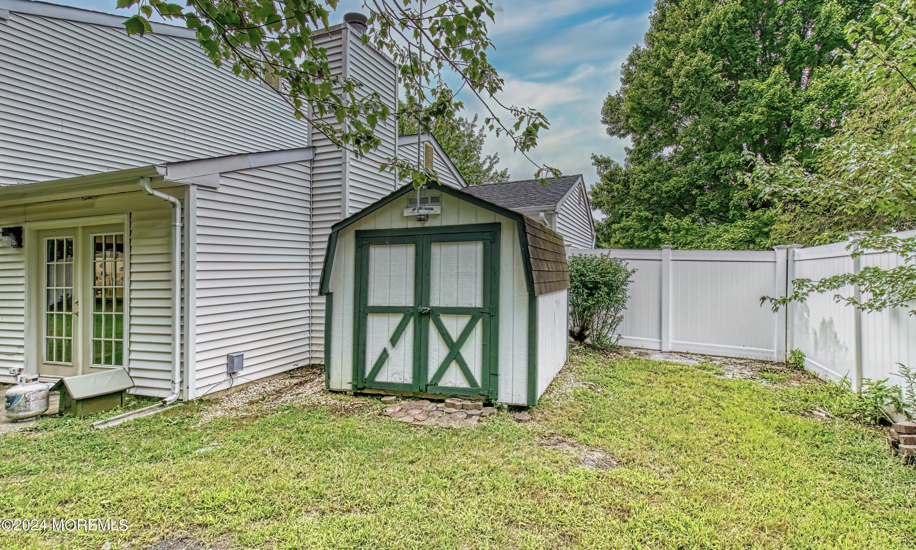 34 Sweetbriar Trail Howell, NJ 07731 - Photo 13 of 53 a front view of a house with a yard