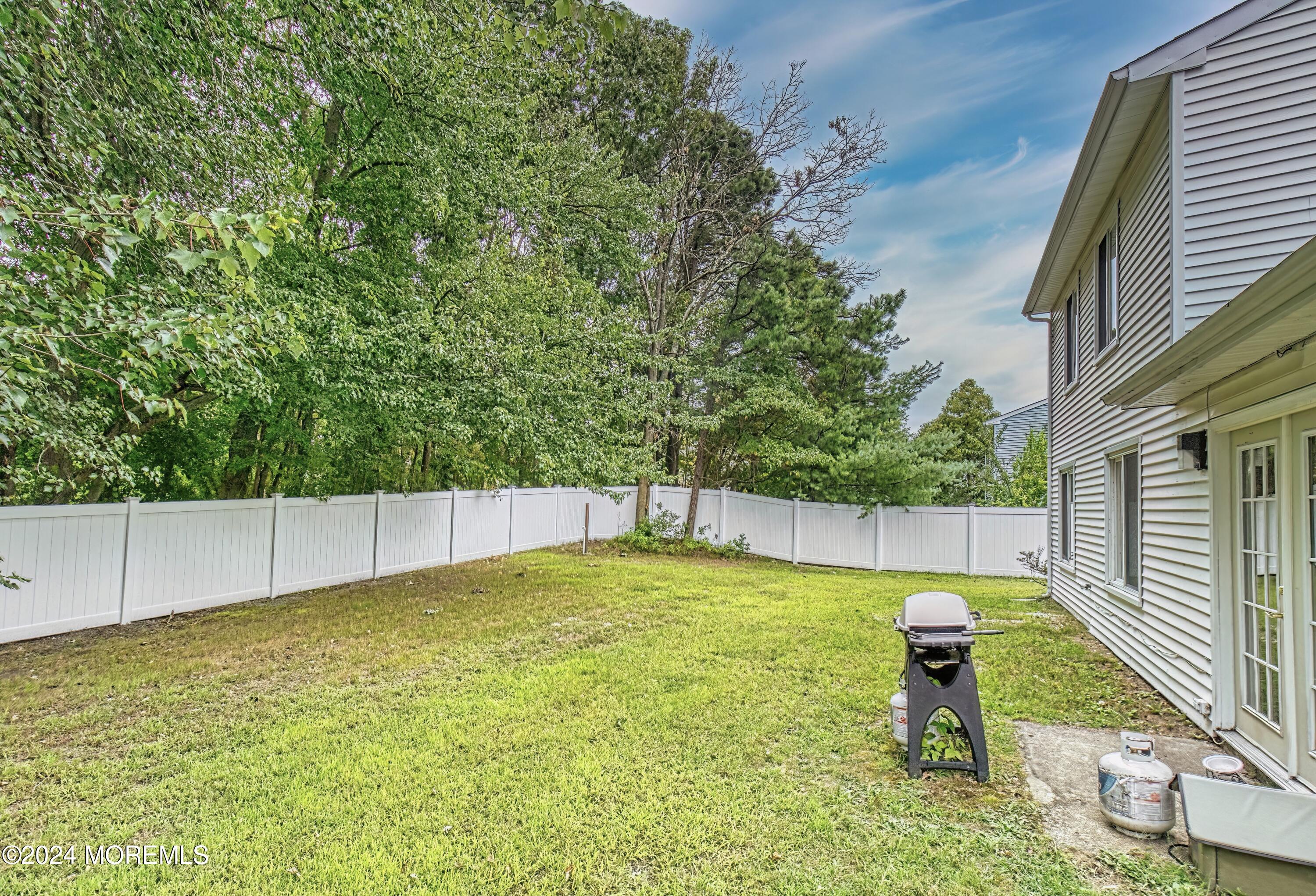 34 Sweetbriar Trail Howell, NJ 07731 - Photo 14 of 53 a view of a swimming pool with a patio and a yard