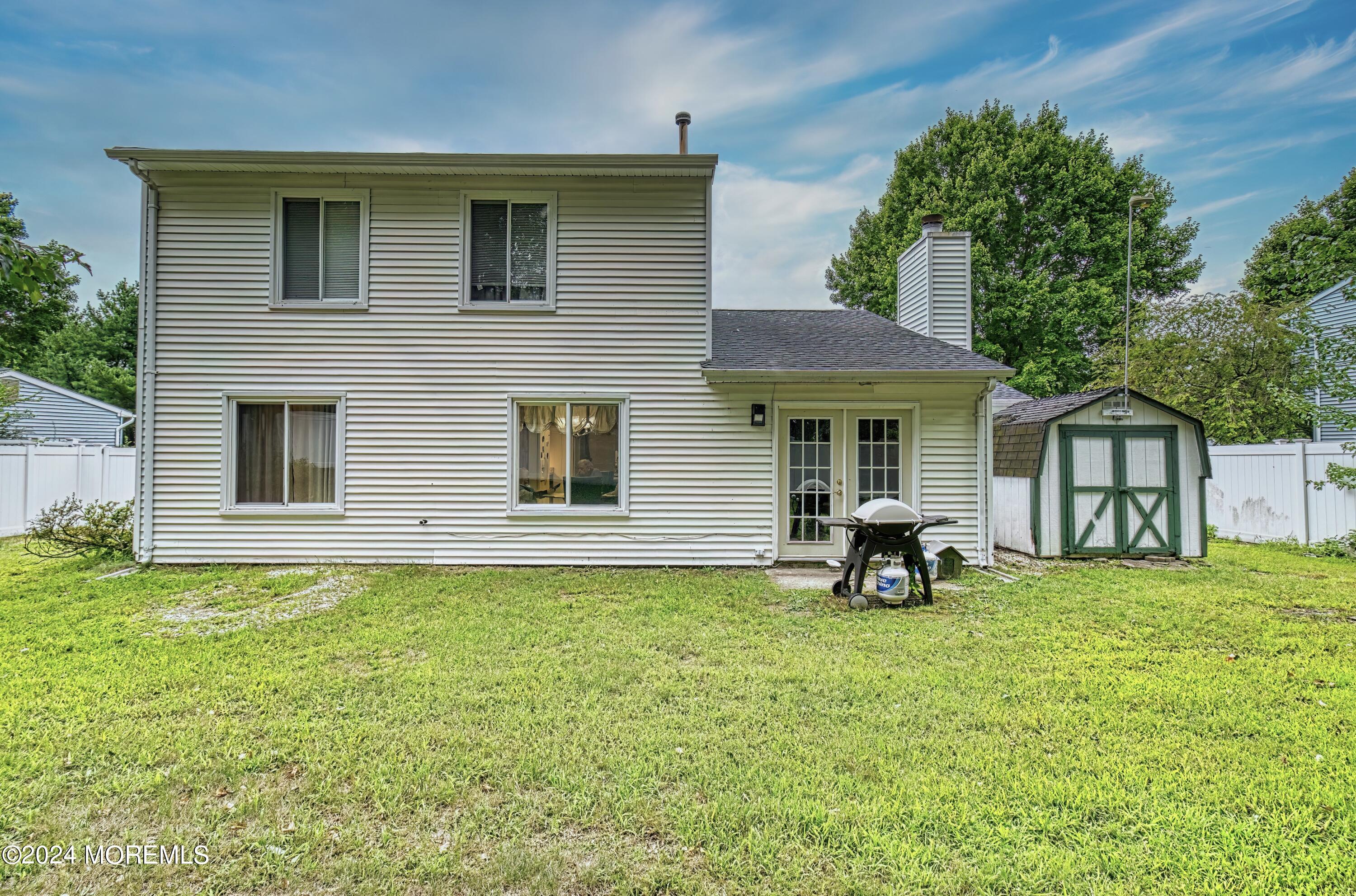 34 Sweetbriar Trail Howell, NJ 07731 - Photo 15 of 53 a front view of a house with a garden and porch