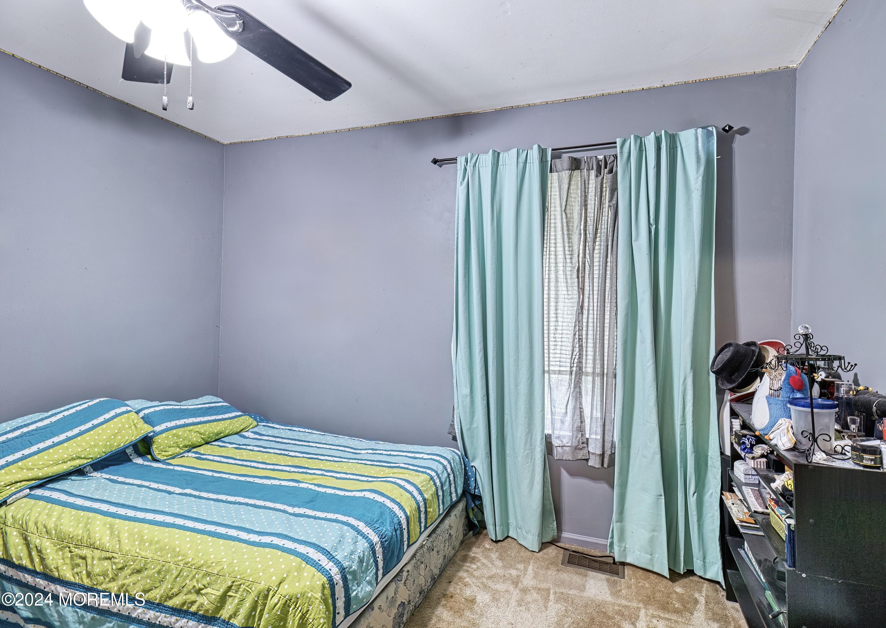 34 Sweetbriar Trail Howell, NJ 07731 - Photo 27 of 53 a bedroom with a bed and a window