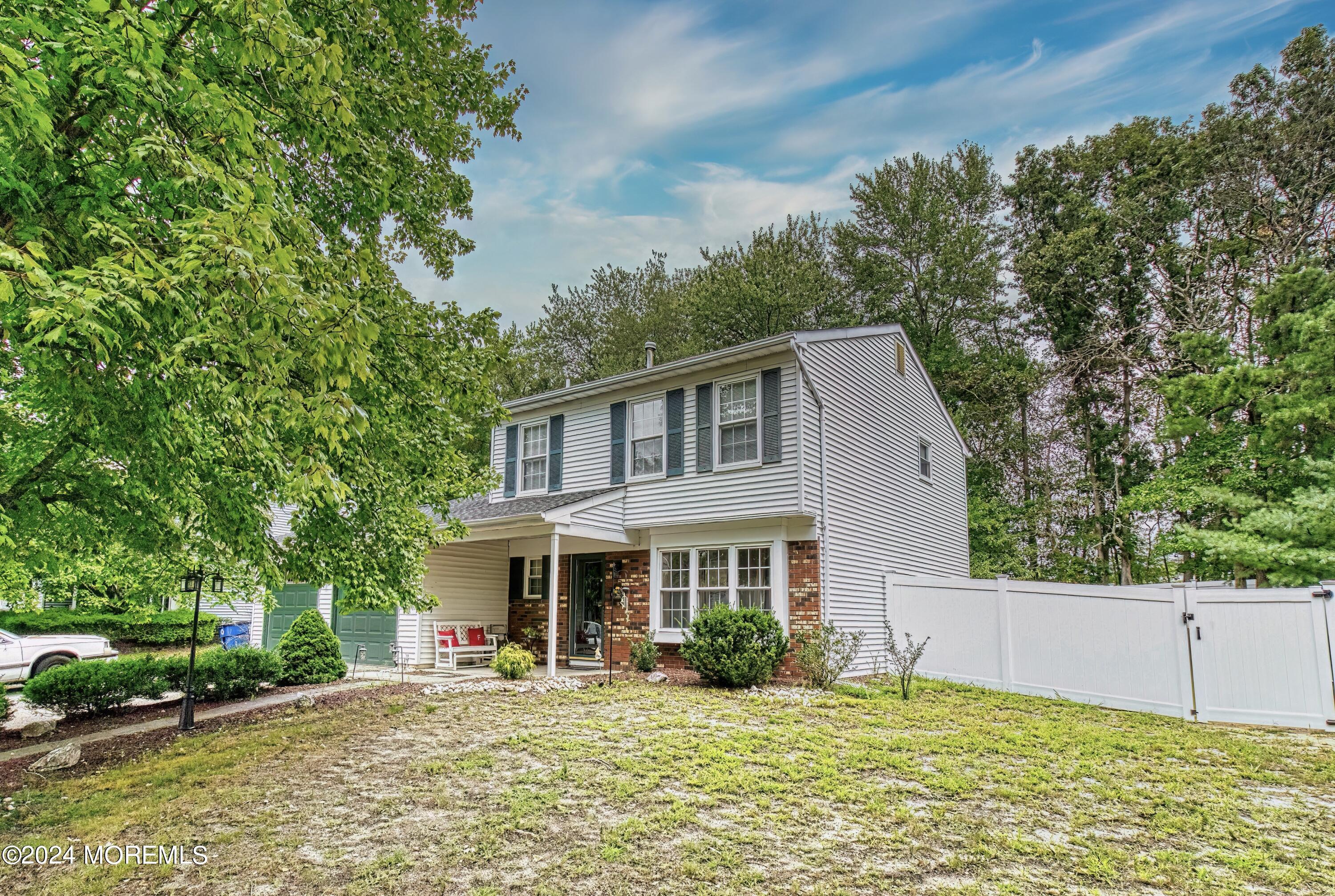 34 Sweetbriar Trail Howell, NJ 07731 - Photo 4 of 53 a front view of a house with a yard