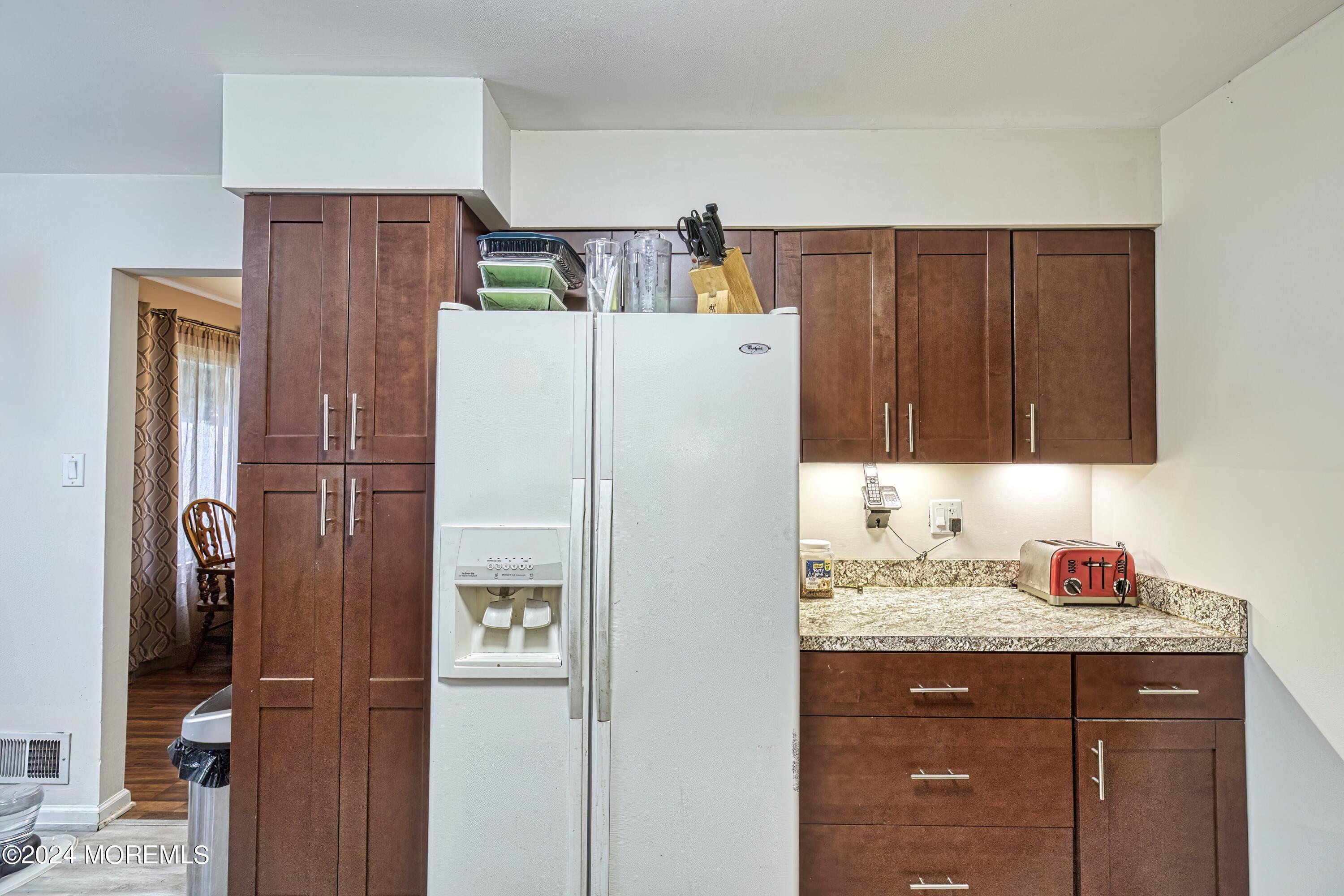 34 Sweetbriar Trail Howell, NJ 07731 - Photo 45 of 53 a white refrigerator freezer sitting inside of a kitchen