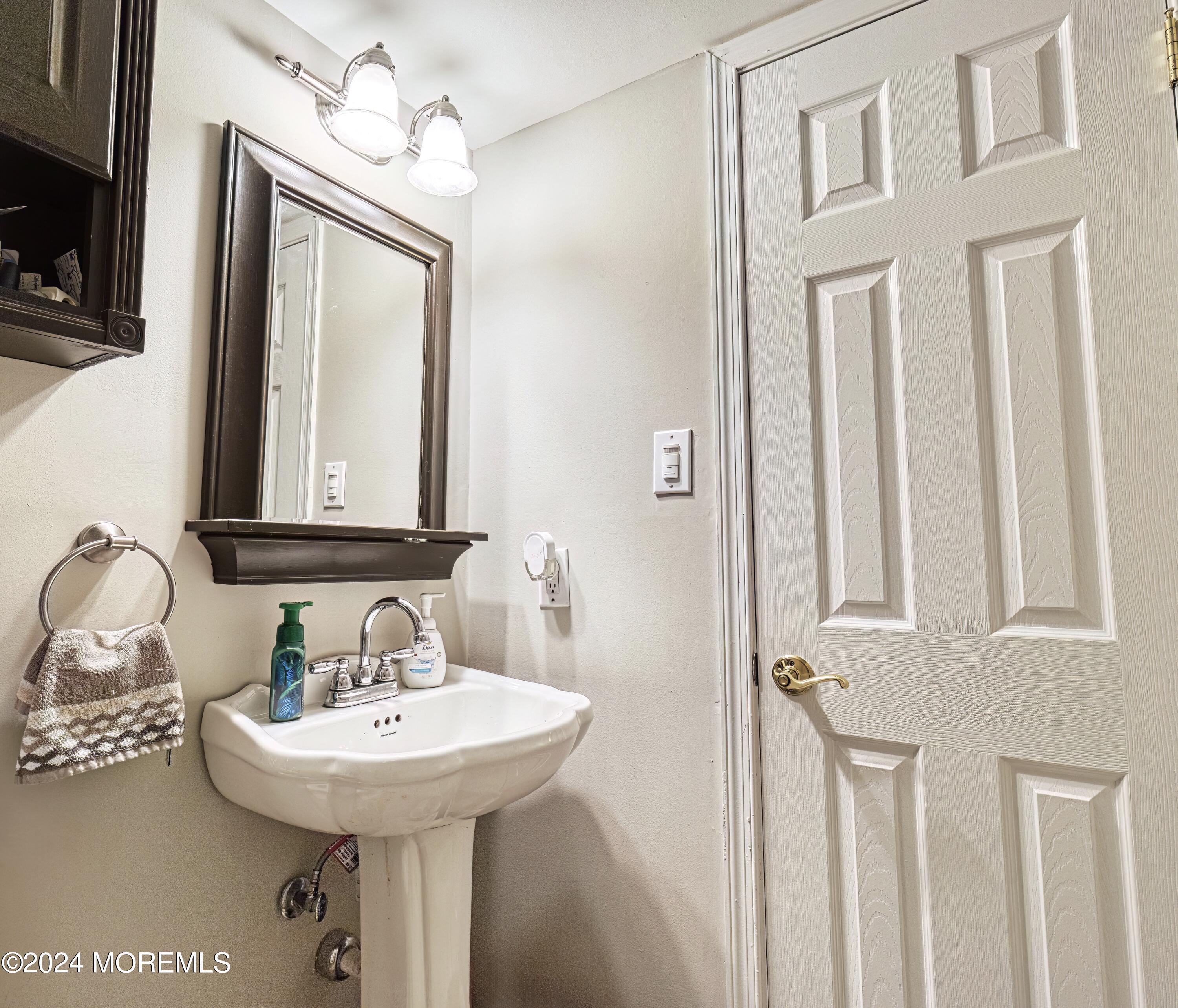 34 Sweetbriar Trail Howell, NJ 07731 - Photo 47 of 53 a bathroom with a sink and a mirror