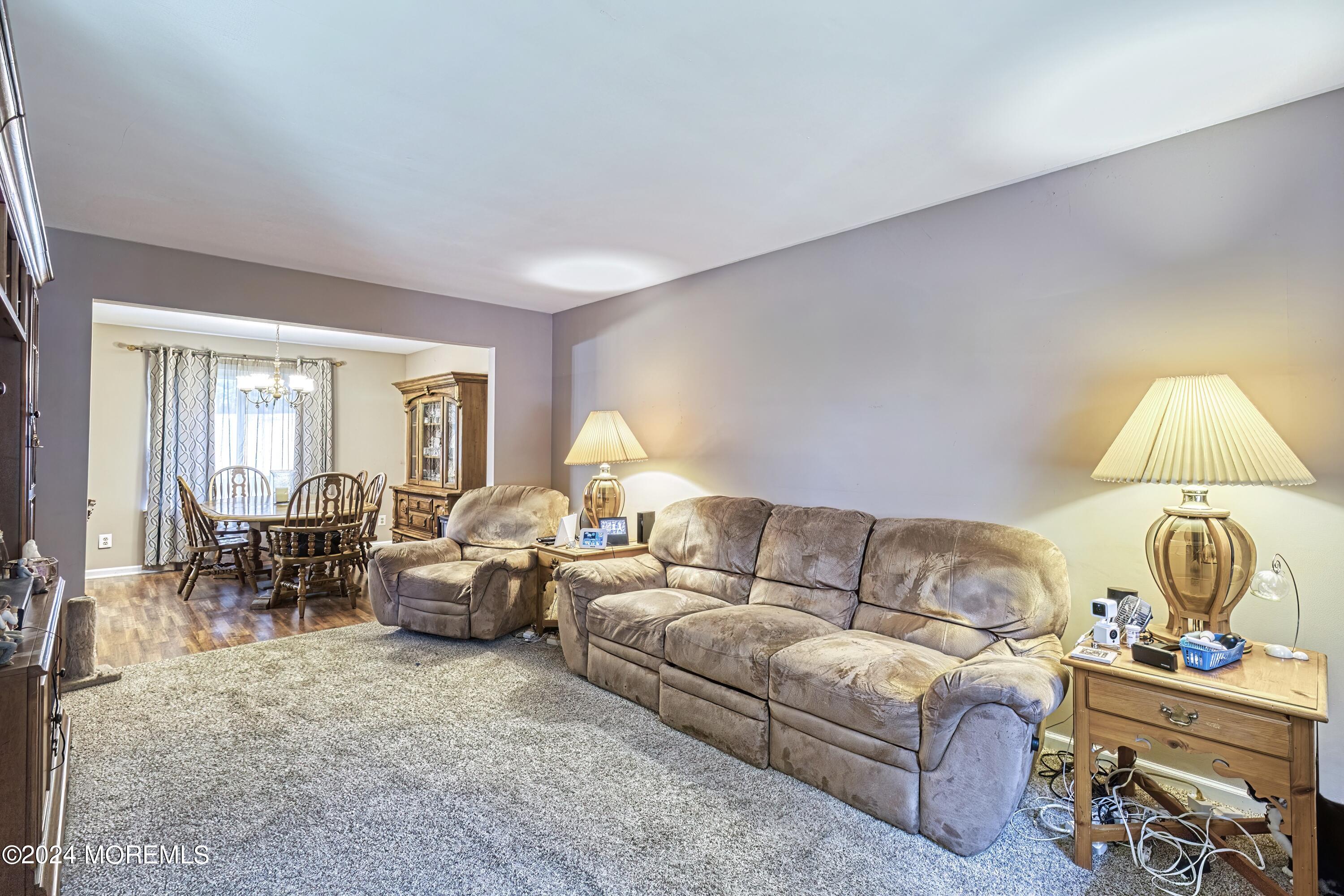 34 Sweetbriar Trail Howell, NJ 07731 - Photo 48 of 53 a living room with furniture and a window