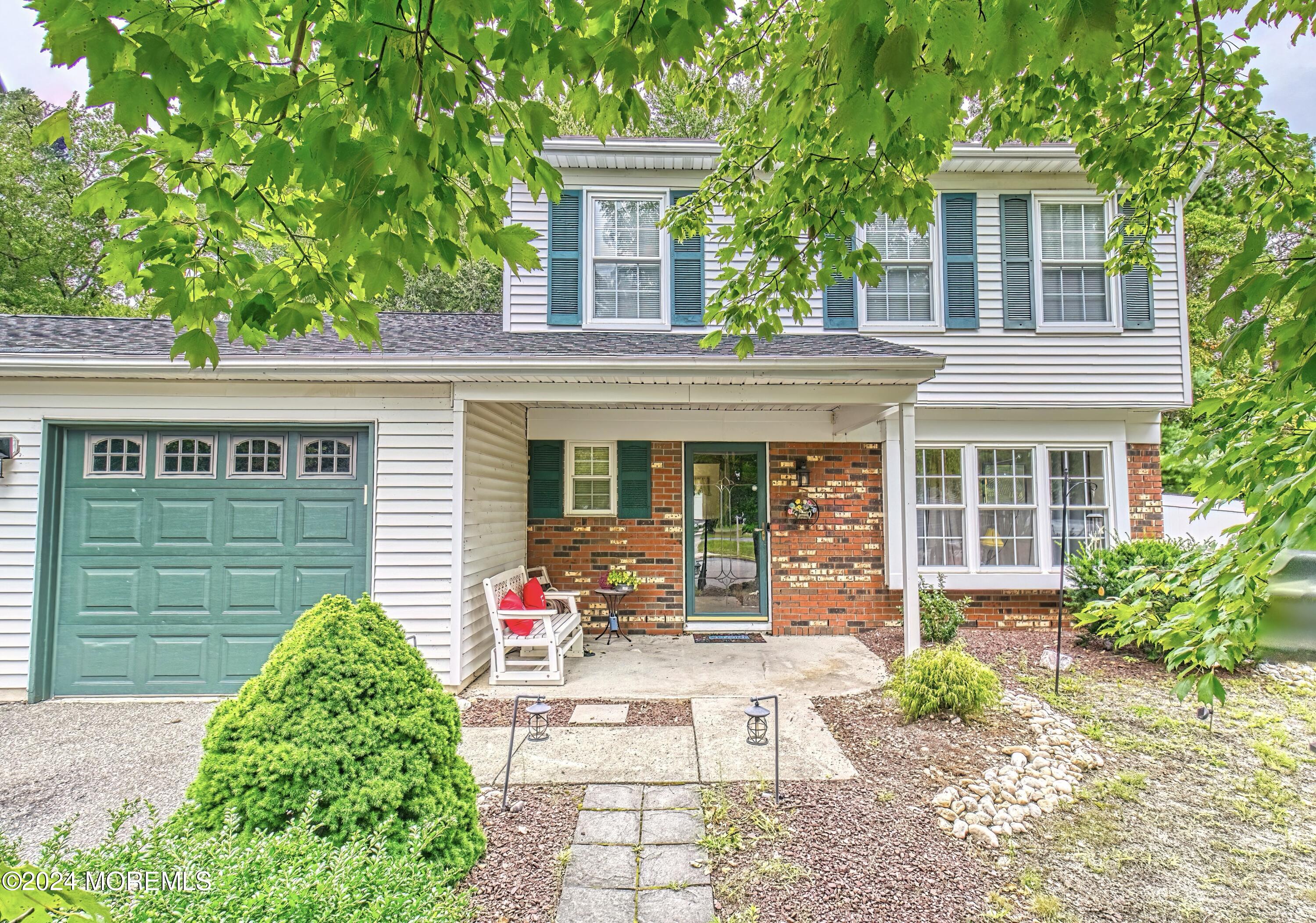 34 Sweetbriar Trail Howell, NJ 07731 - Photo 5 of 53 a front view of a house with a yard