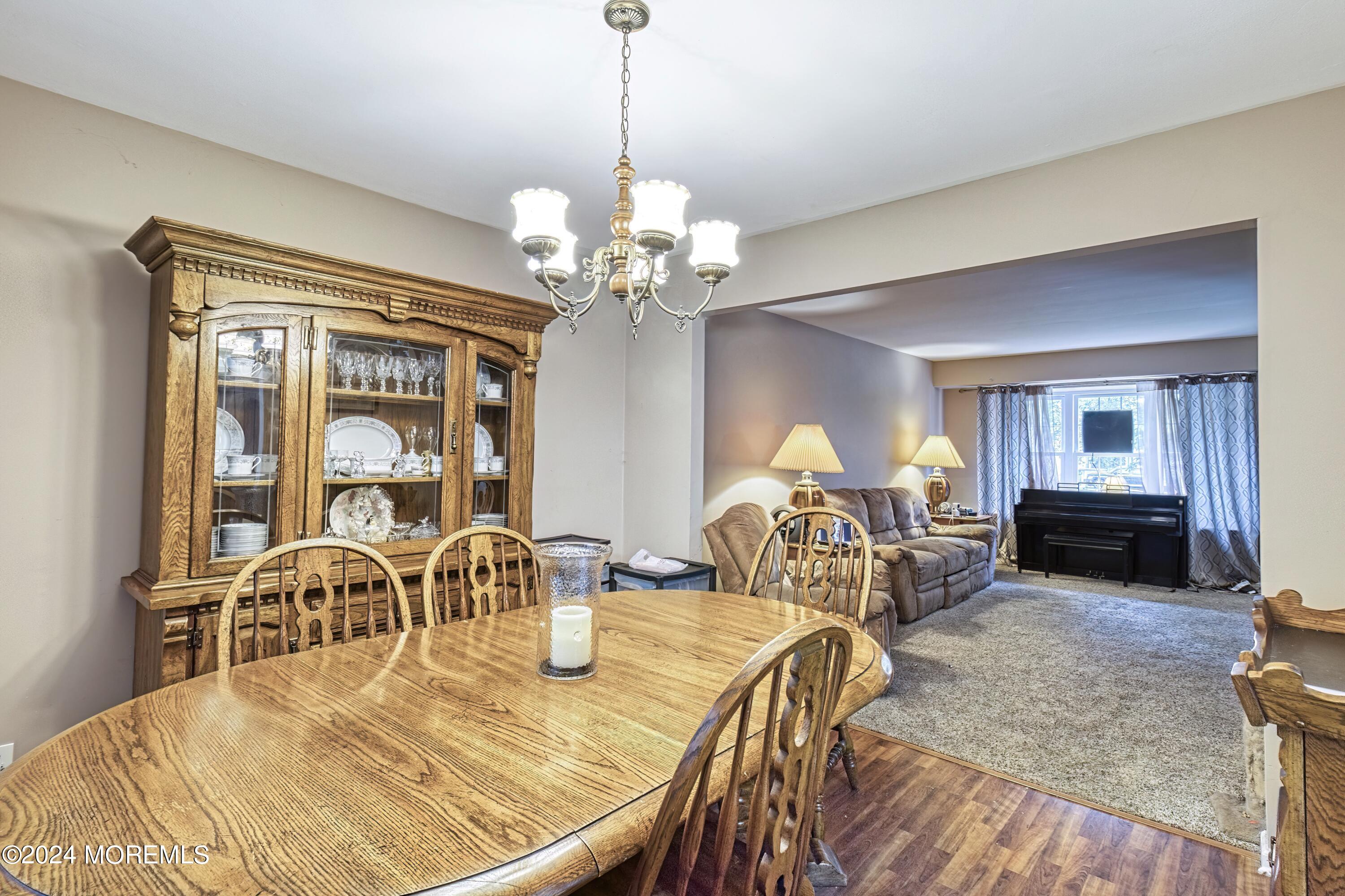 34 Sweetbriar Trail Howell, NJ 07731 - Photo 51 of 53 a view of a dining room with furniture and chandelier