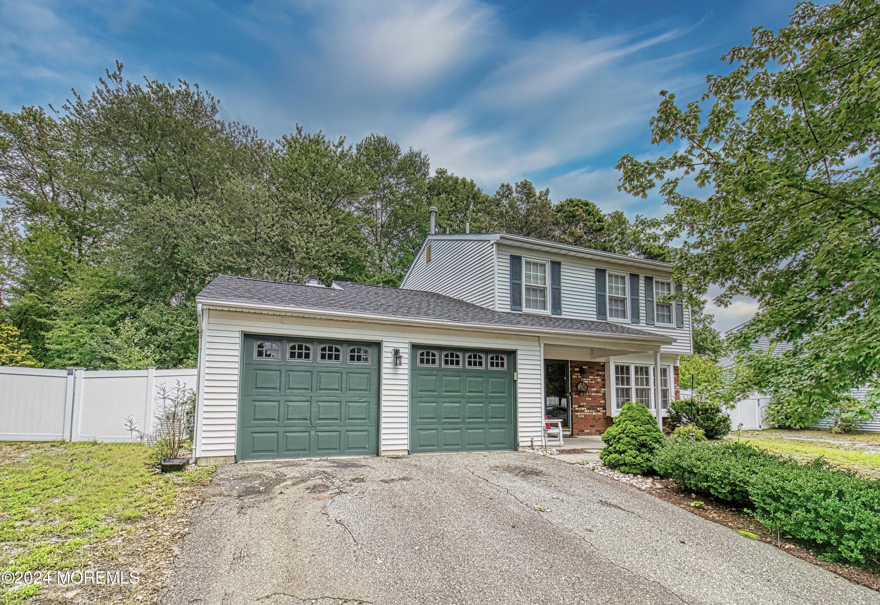 34 Sweetbriar Trail Howell, NJ 07731 - Photo 6 of 53 a front view of a house with a garden
