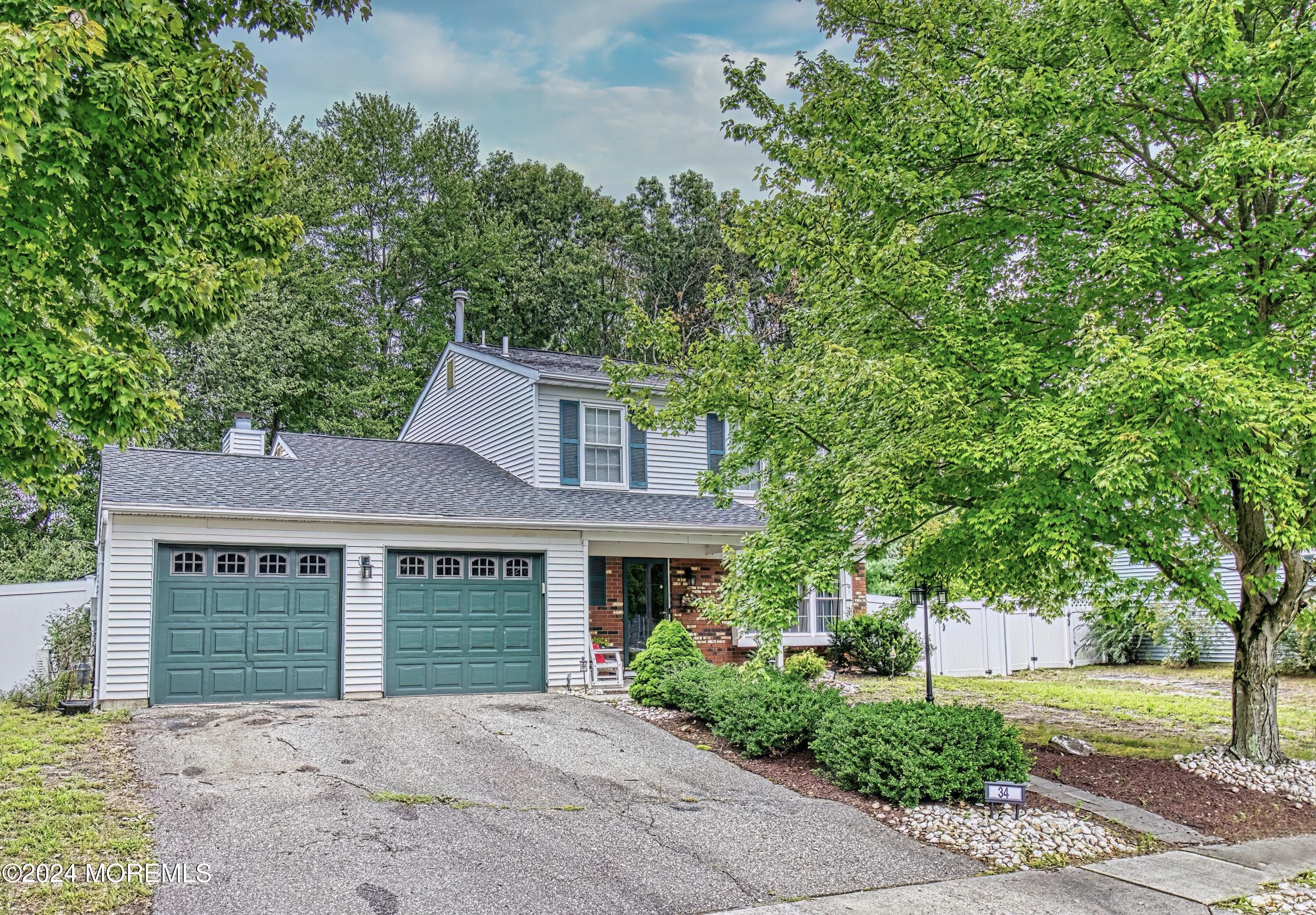 34 Sweetbriar Trail Howell, NJ 07731 - Photo 7 of 53 front view of a house with a yard