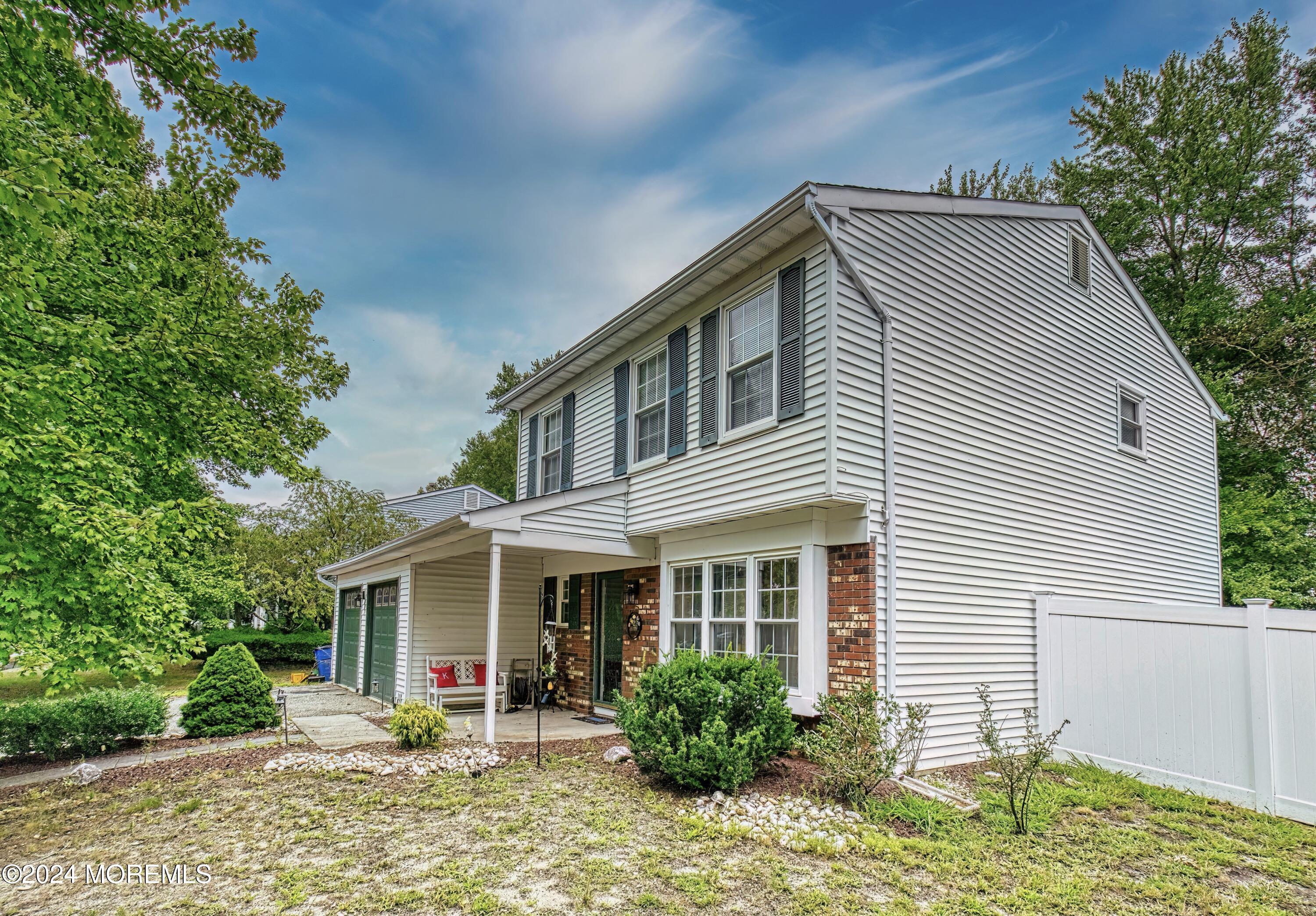 34 Sweetbriar Trail Howell, NJ 07731 - Photo 8 of 53 a front view of a house with garden