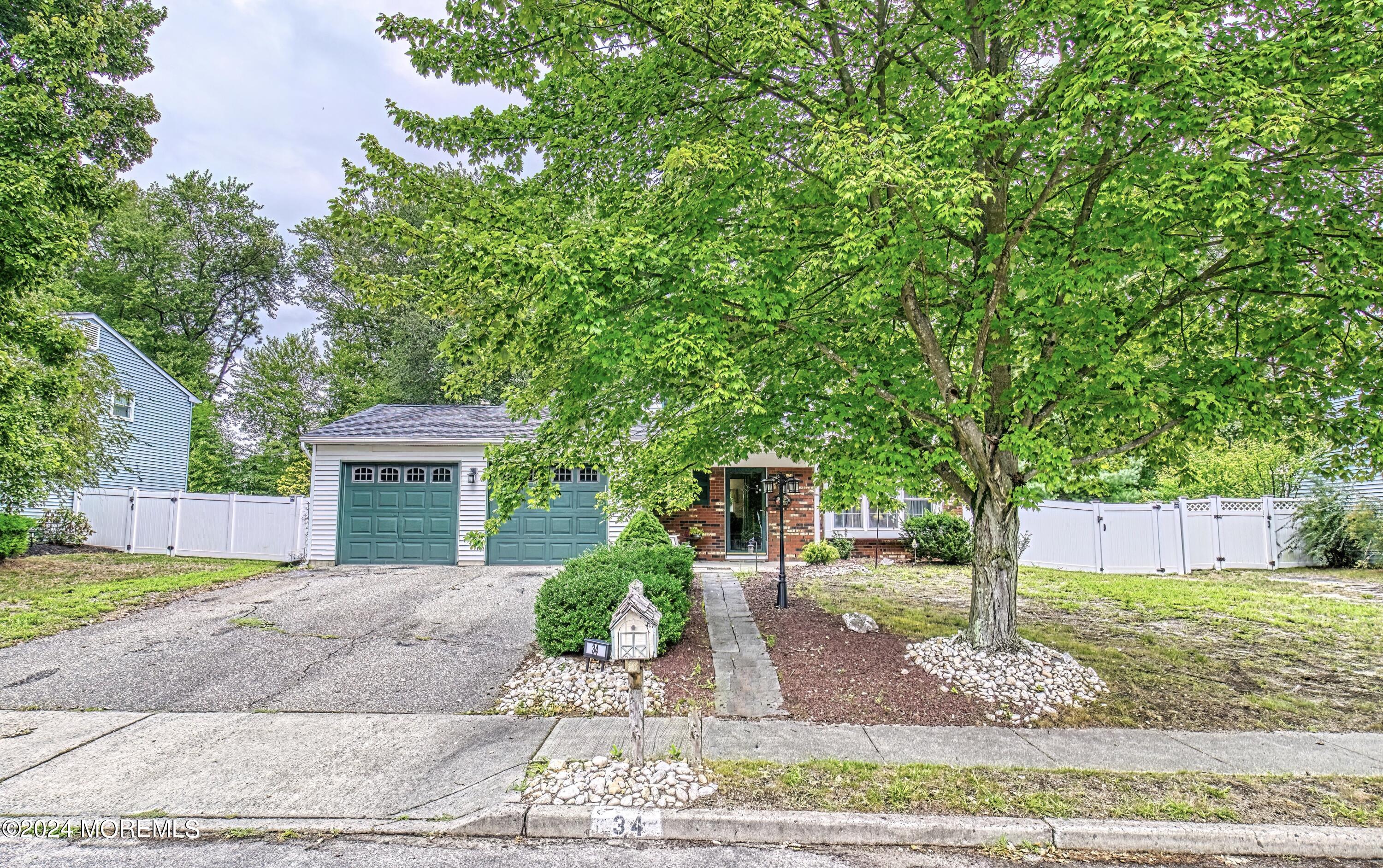 34 Sweetbriar Trail Howell, NJ 07731 - Photo 9 of 53 a front view of a house with garden