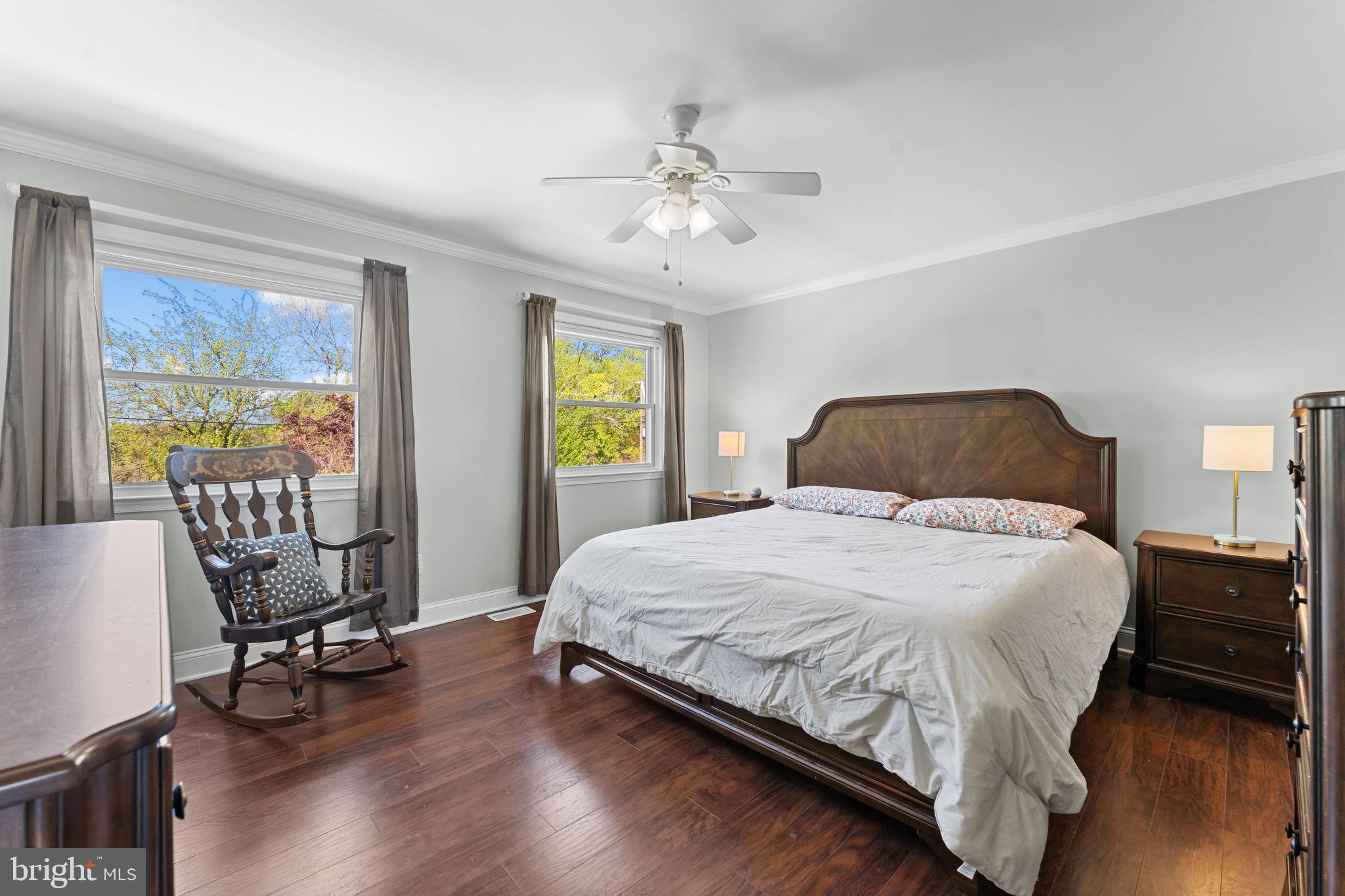 418 Harrison Street Riverside, NJ 08075 - Photo 12 of 29 a bedroom with a bed a table and chair