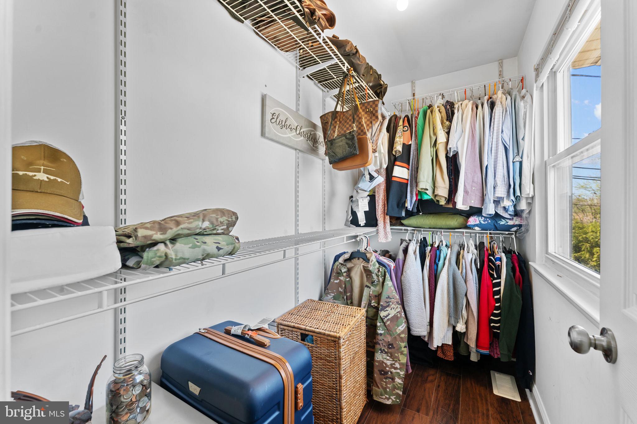 418 Harrison Street Riverside, NJ 08075 - Photo 14 of 29 a view of walk in closet with clothes and shoes