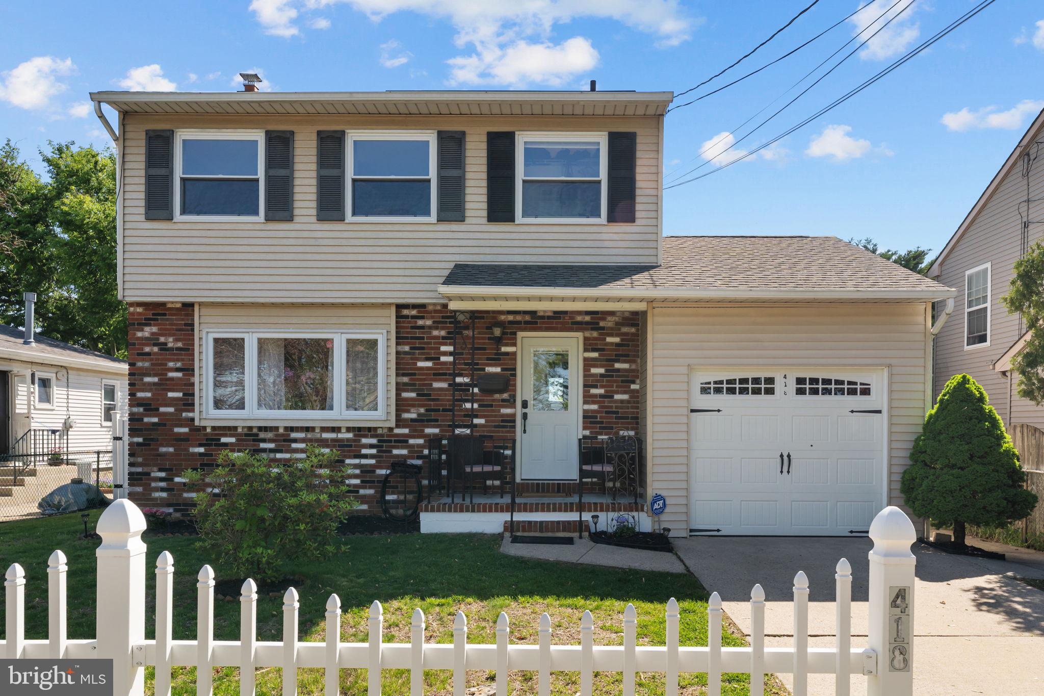 418 Harrison Street Riverside, NJ 08075 - Photo 2 of 29 a front view of a house with garden