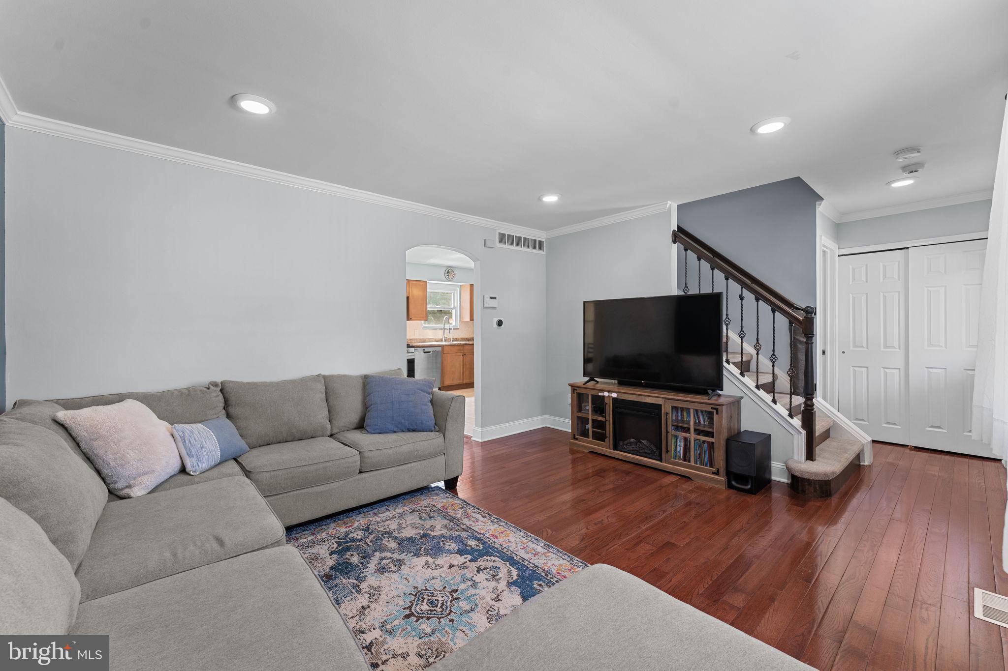 418 Harrison Street Riverside, NJ 08075 - Photo 4 of 29 a living room with furniture and a flat screen tv