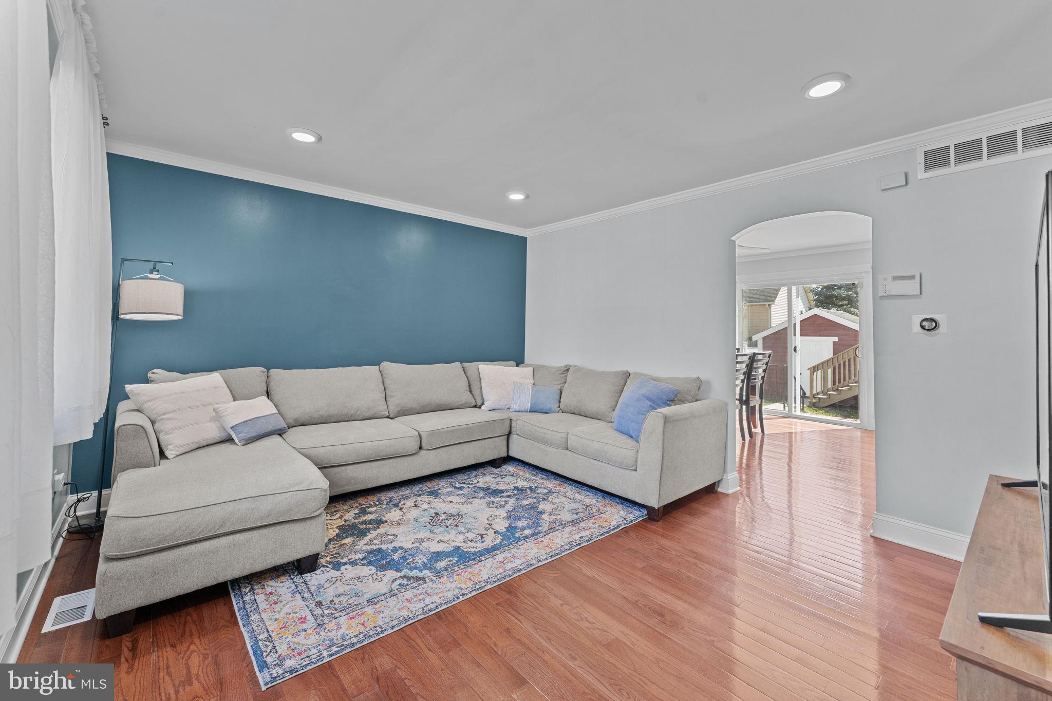 418 Harrison Street Riverside, NJ 08075 - Photo 5 of 29 a living room with furniture and a wooden floor