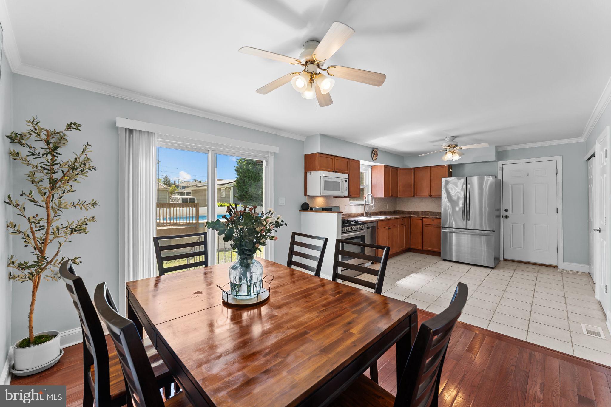 418 Harrison Street Riverside, NJ 08075 - Photo 7 of 29 a view of a dining room with furniture and wooden floor