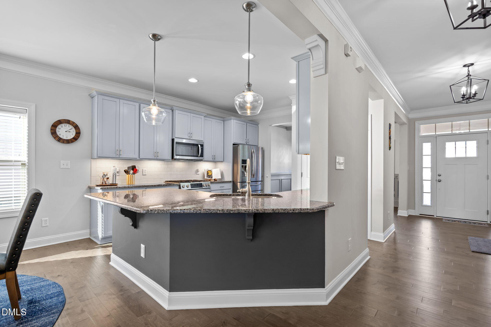 3528 Jones Lake Road Fuquay-Varina, NC 27526 - Photo 13 of 50 a kitchen with stainless steel appliances granite countertop a sink a stove and a wooden floors