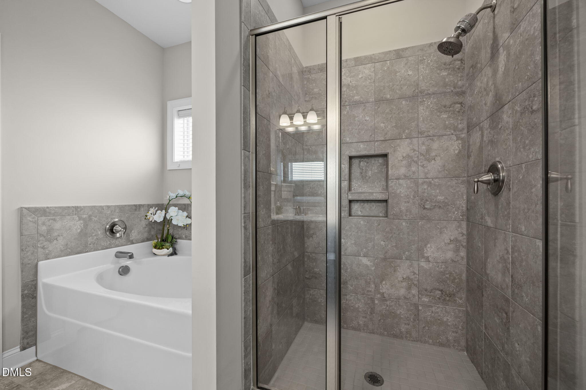 3528 Jones Lake Road Fuquay-Varina, NC 27526 - Photo 24 of 50 a bathroom with a bathtub and shower