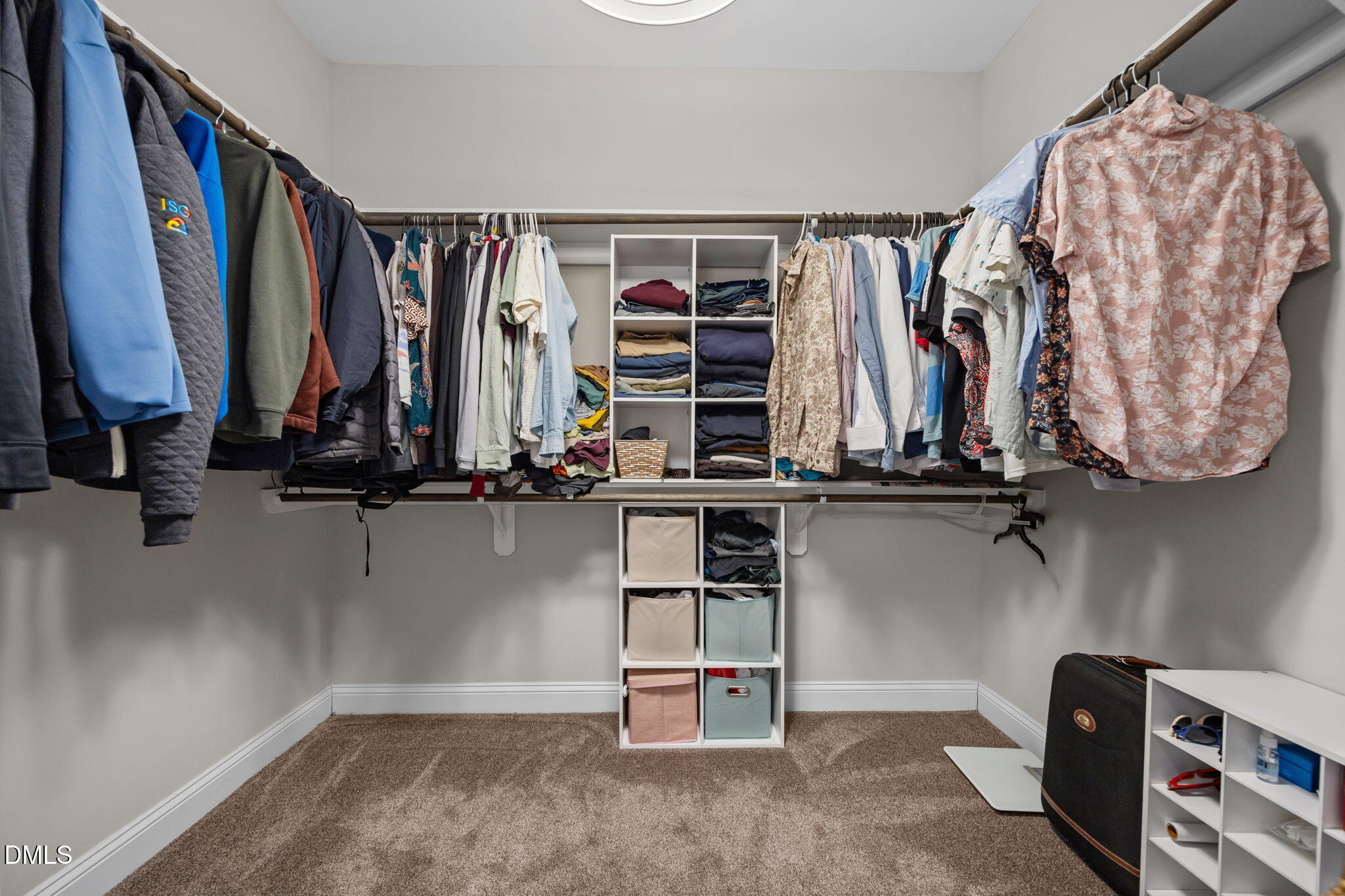3528 Jones Lake Road Fuquay-Varina, NC 27526 - Photo 26 of 50 a view of walk in closet with clothes and shoes