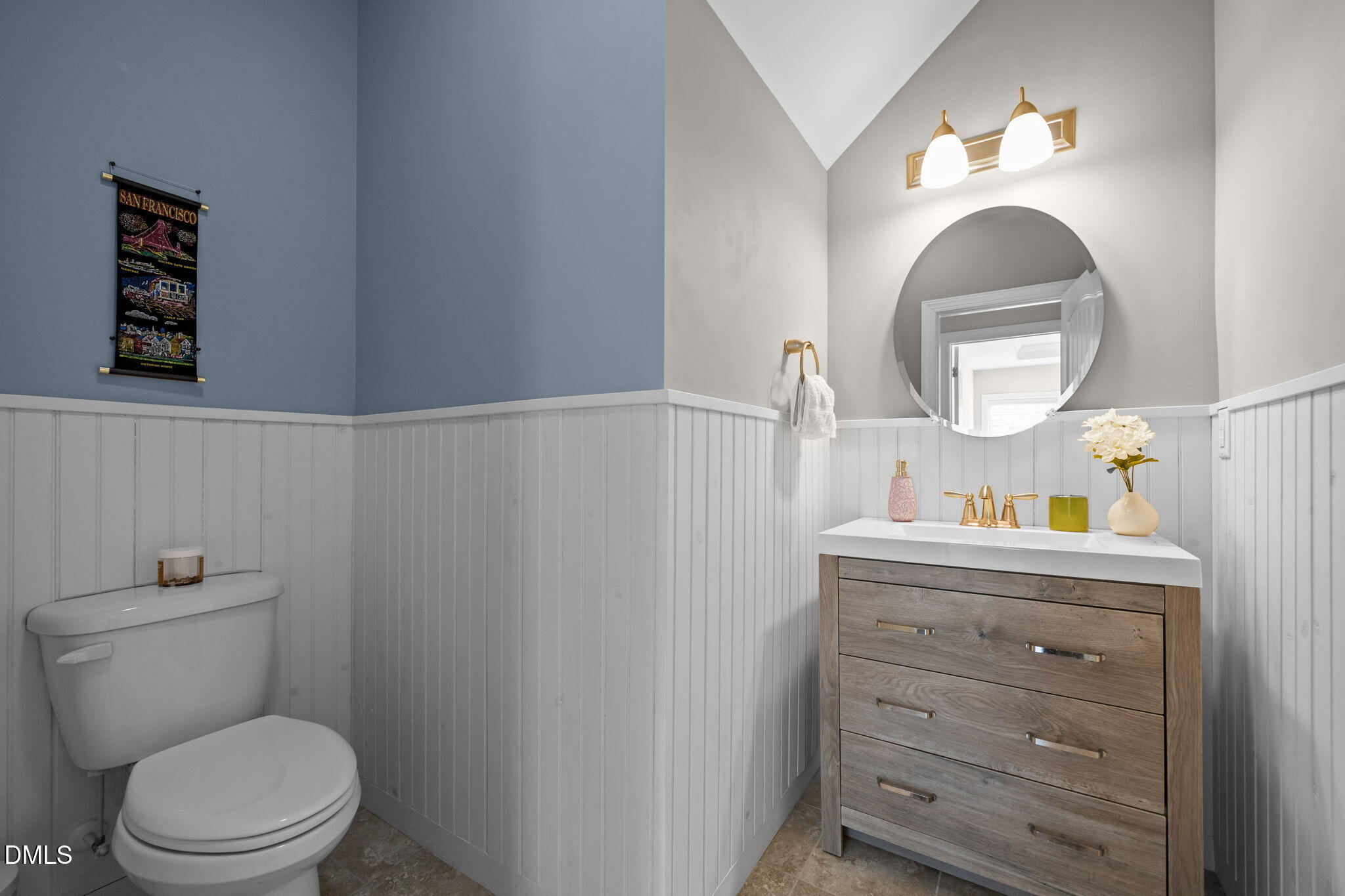 3528 Jones Lake Road Fuquay-Varina, NC 27526 - Photo 28 of 50 a bathroom with a toilet a sink and a mirror