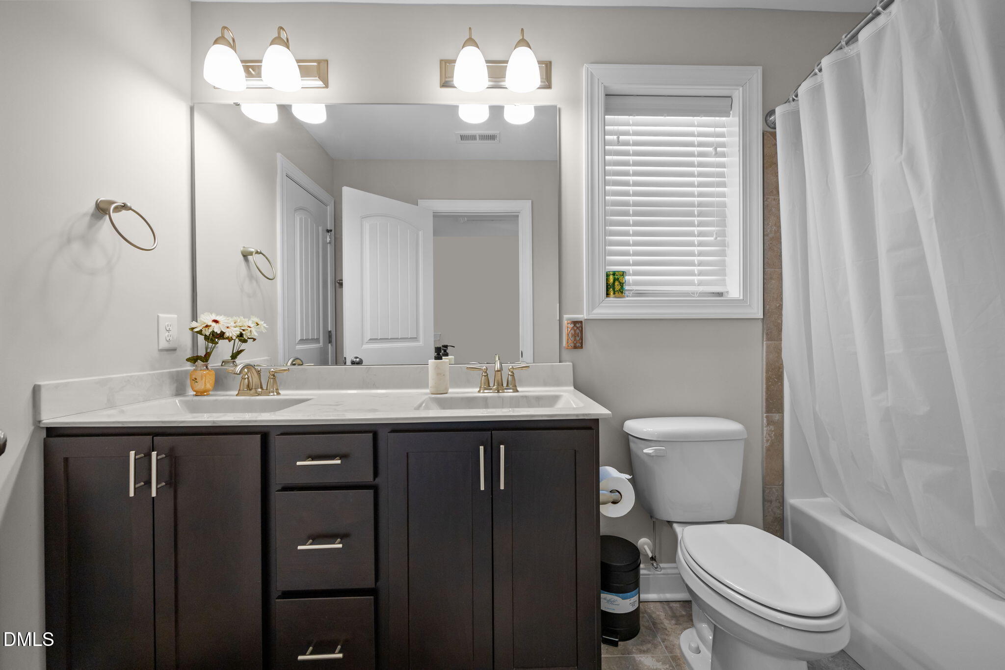 3528 Jones Lake Road Fuquay-Varina, NC 27526 - Photo 33 of 50 a bathroom with a toilet sink and mirror