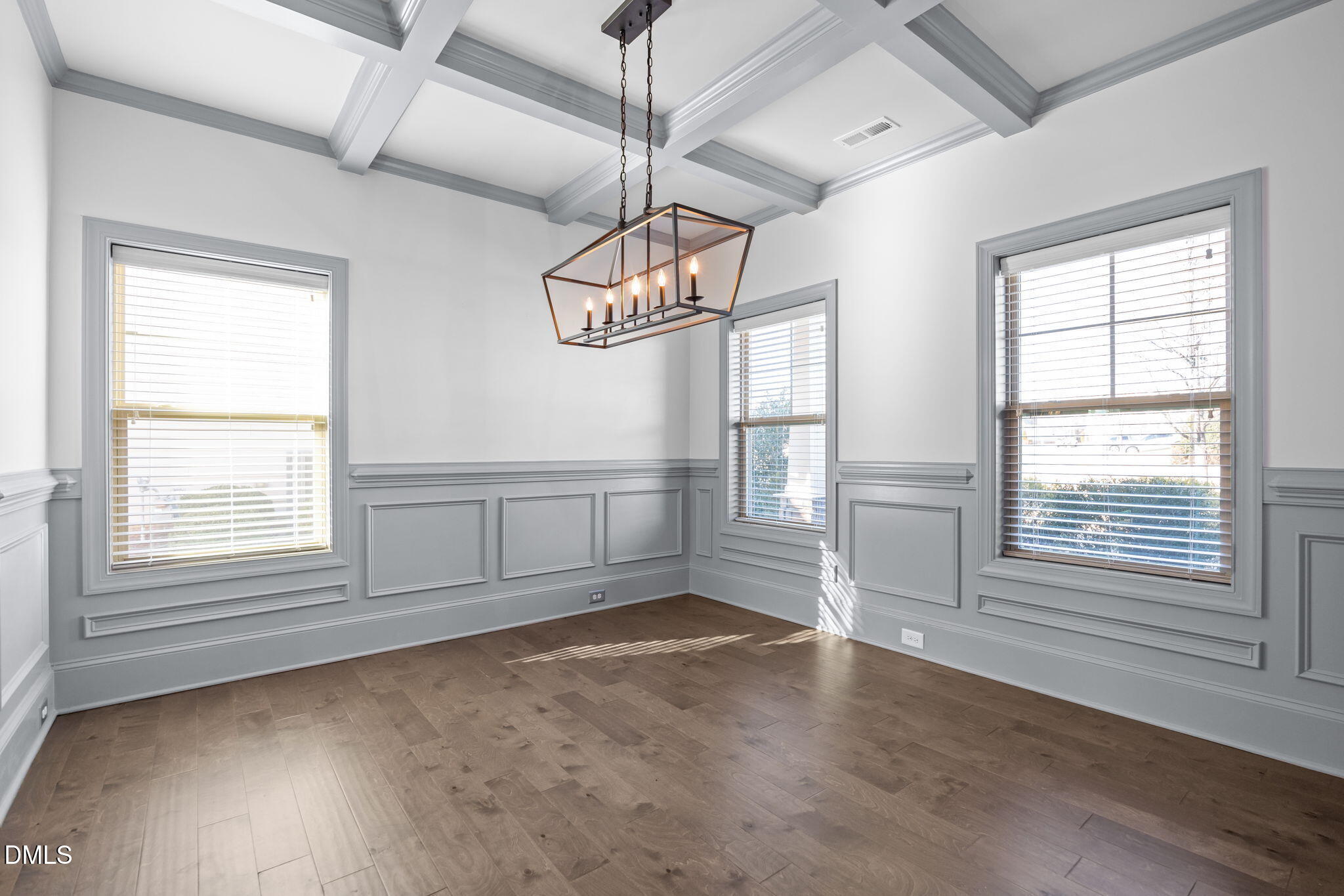 3528 Jones Lake Road Fuquay-Varina, NC 27526 - Photo 7 of 50 an empty room with wooden floor fan and windows