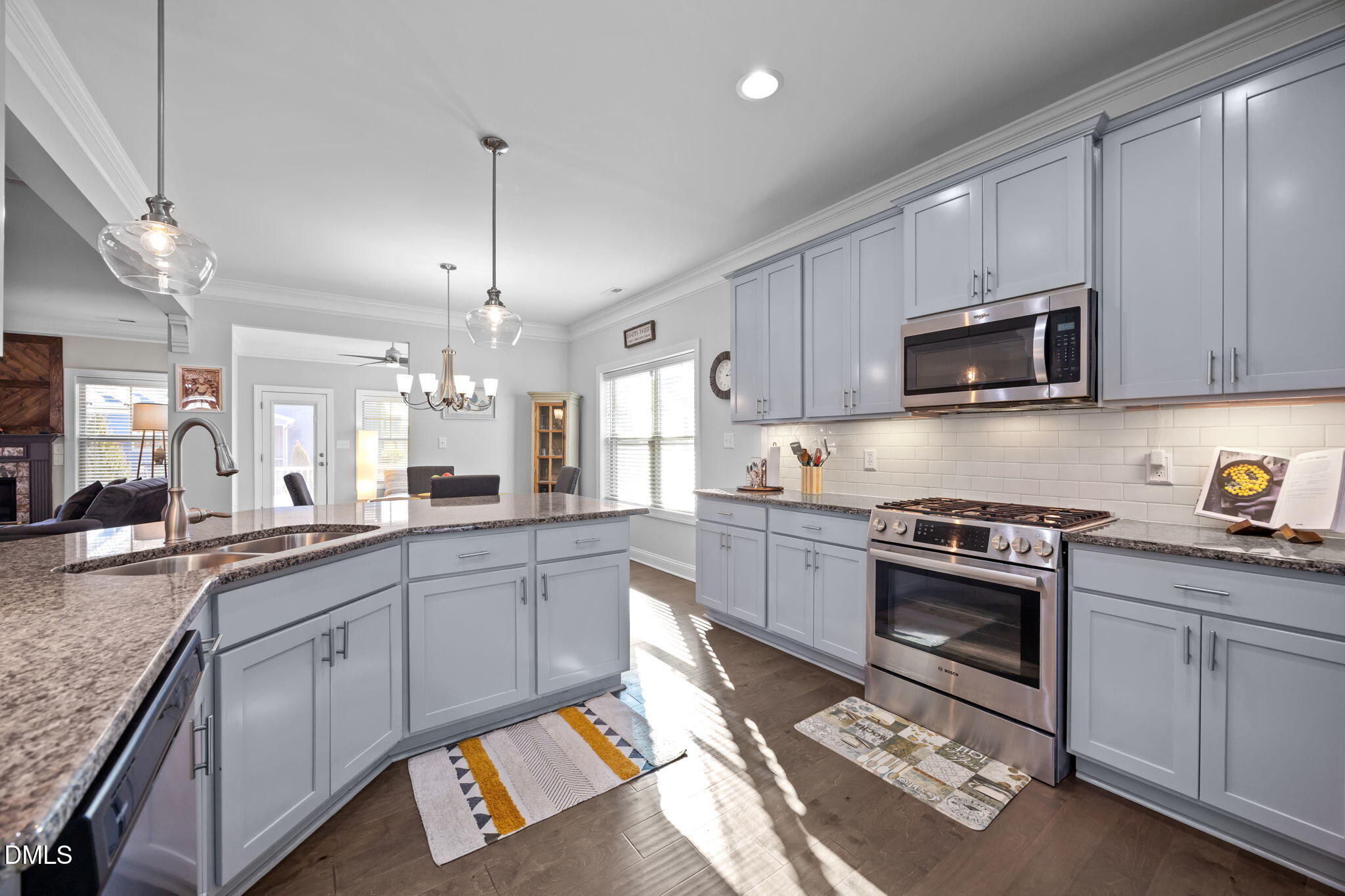 3528 Jones Lake Road Fuquay-Varina, NC 27526 - Photo 9 of 50 a kitchen with stainless steel appliances granite countertop a sink stove and microwave