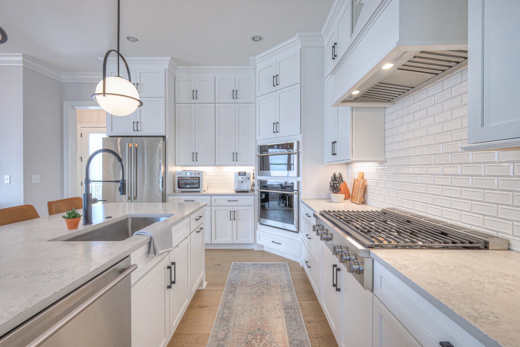 2042 Nathaniel Road Franklin, TN 37064 - Photo 15 of 40 a kitchen with granite countertop a sink stove and cabinets