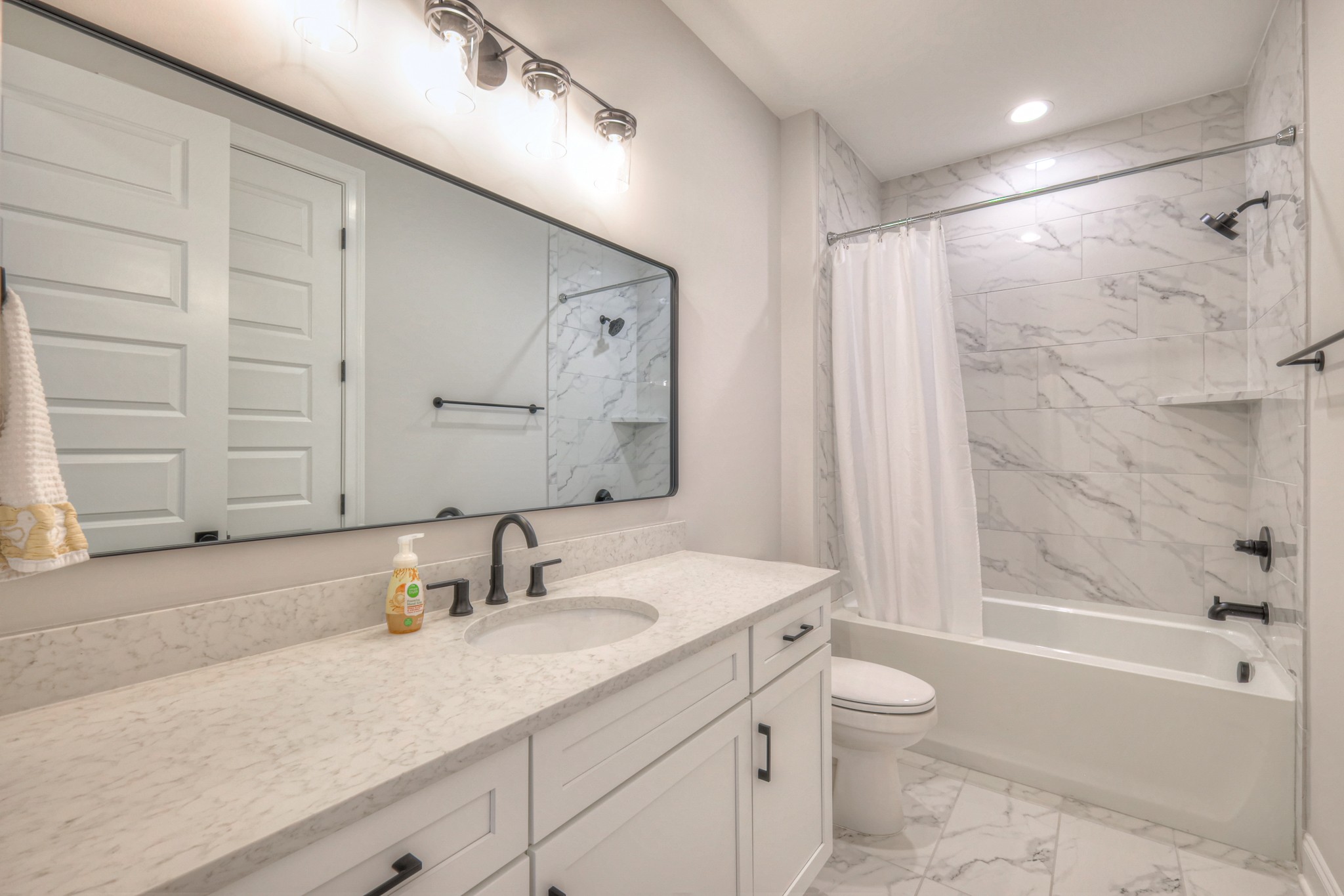 2042 Nathaniel Road Franklin, TN 37064 - Photo 33 of 40 a bathroom with a granite countertop sink a toilet and shower
