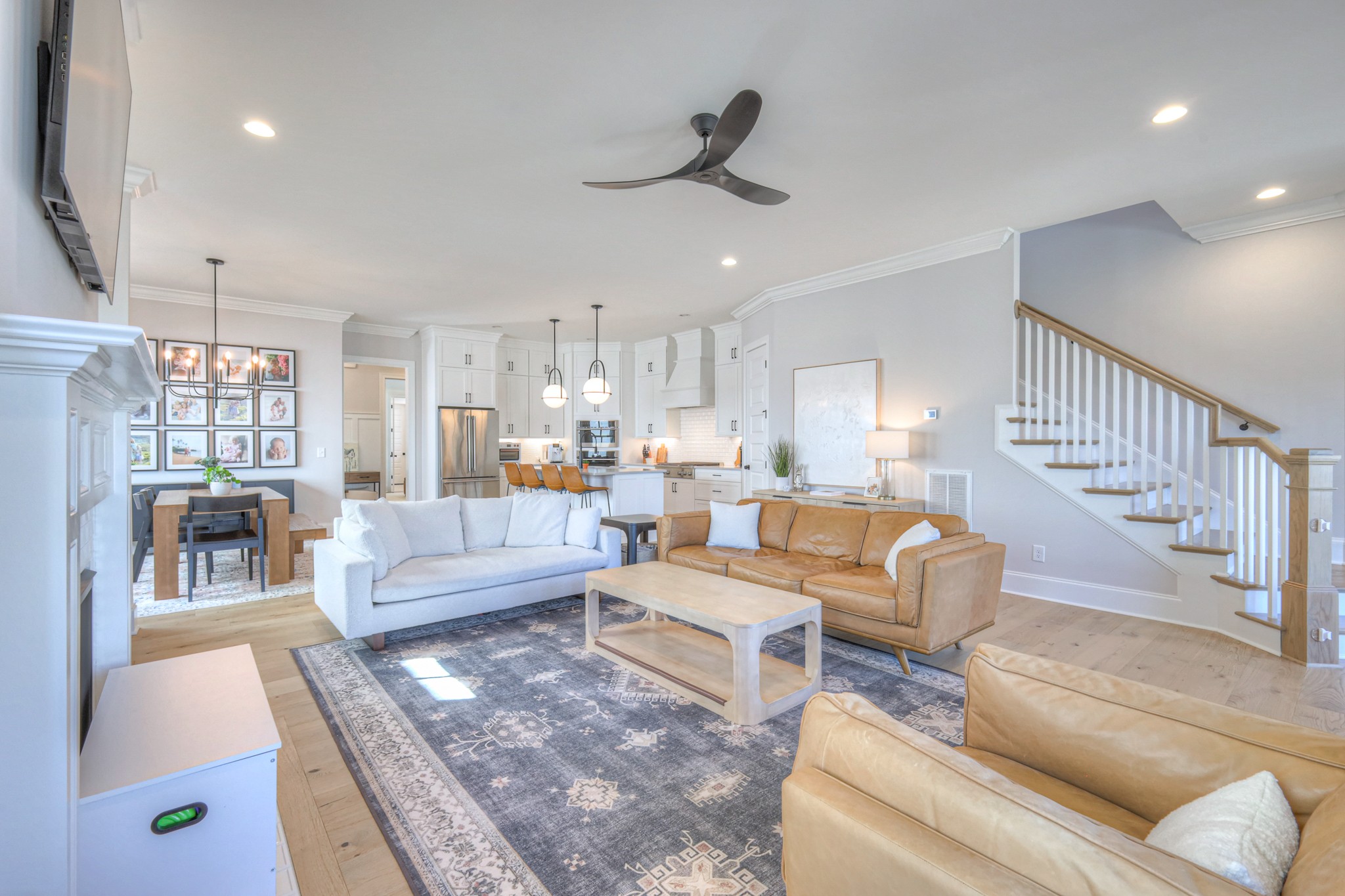 2042 Nathaniel Road Franklin, TN 37064 - Photo 7 of 40 a living room with furniture and a dining table with rug floor