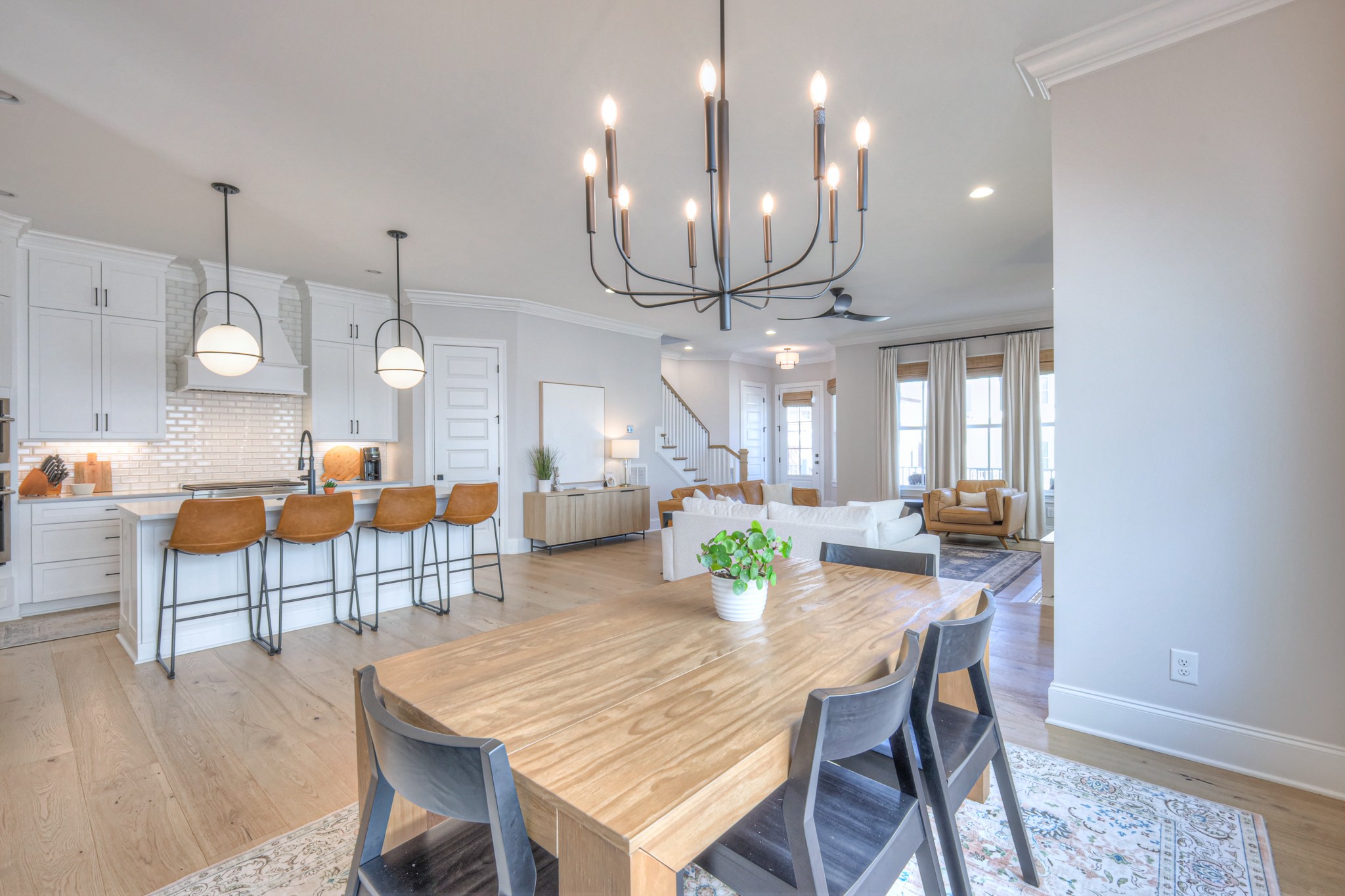 2042 Nathaniel Road Franklin, TN 37064 - Photo 10 of 40 a outdoor dining area with a table a chairs and wooden floor