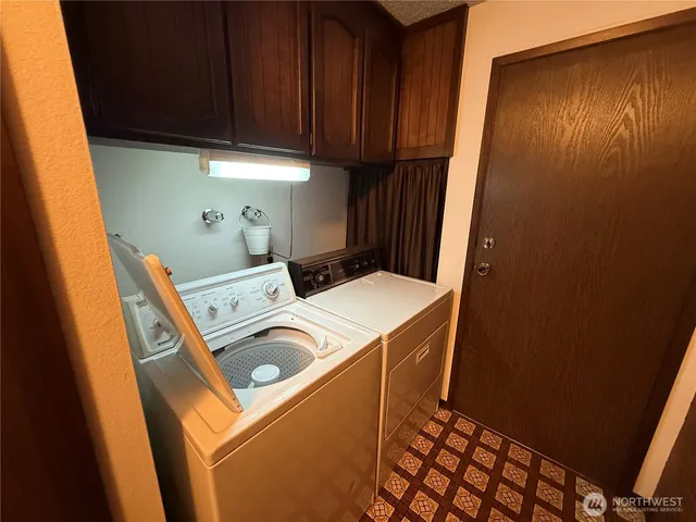 a view of a storage & utility room with a window
