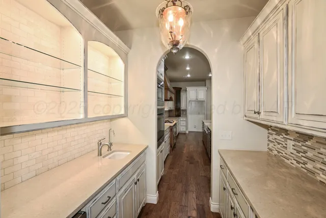 a view of a livingroom with a ceiling fan and window