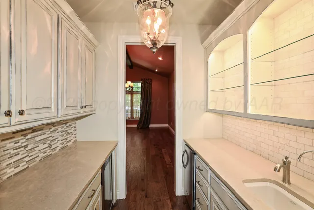 a bathroom with a tub sink shower and a mirror